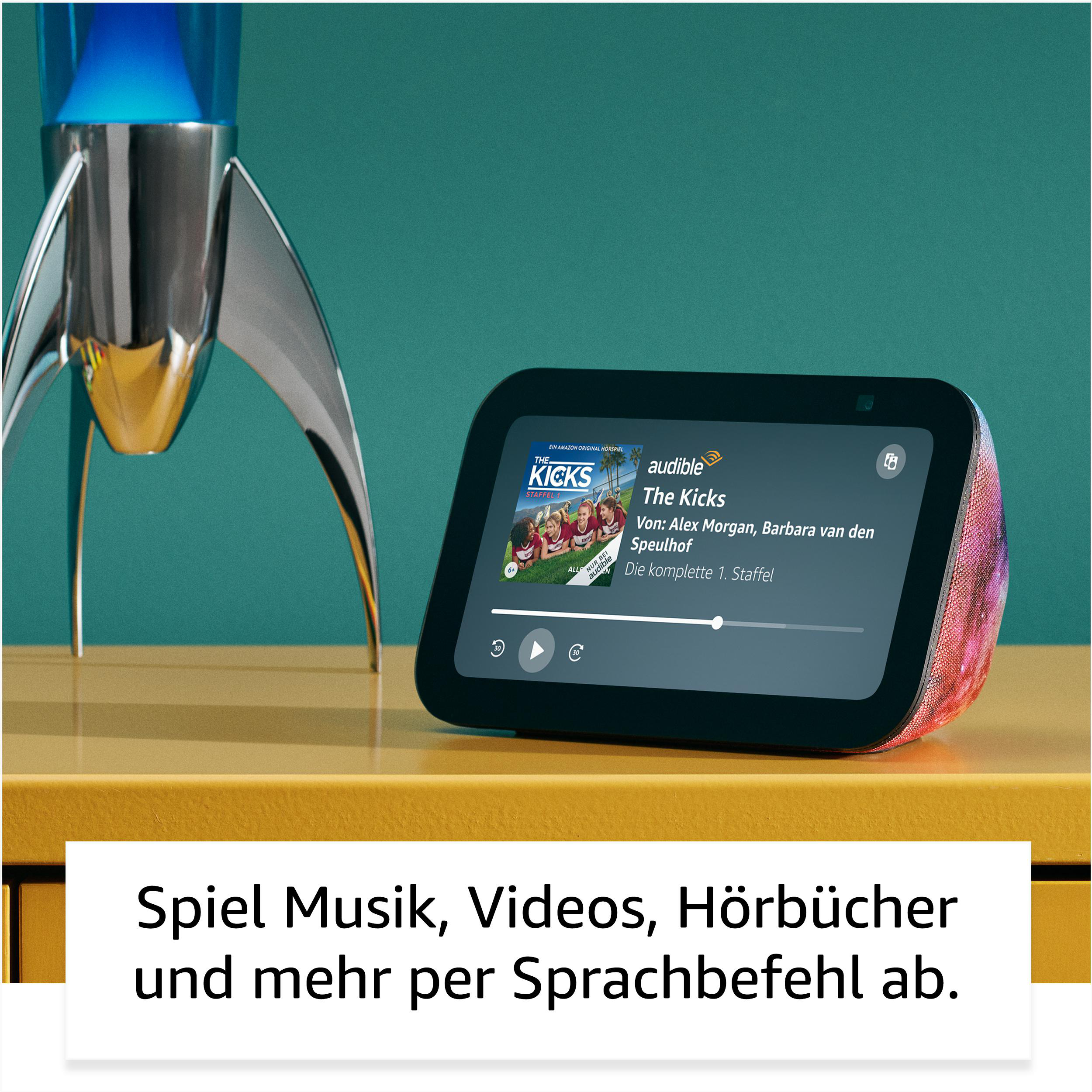 Smart Display mit Rakete, spielt Video ab. Text: Spiele Musik, Videos, Hörbücher.