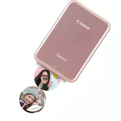 Rózsaszín arany Canon Zoemini nyomtató. Két kis, kerek fotót nyomtat emberekről.