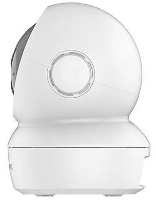 Biała kamera bezpieczeństwa. Zaokrąglona góra, biały korpus. Obiektyw jest czarny, podstawa płaska.