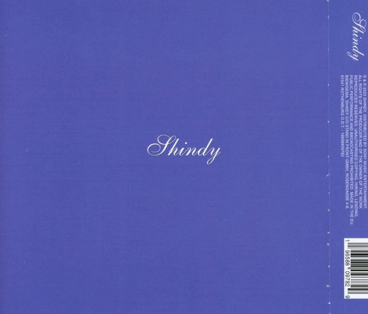 Ein blaues CD-Albumcover mit dem Wort 'Shindy' und etwas weißem Text.