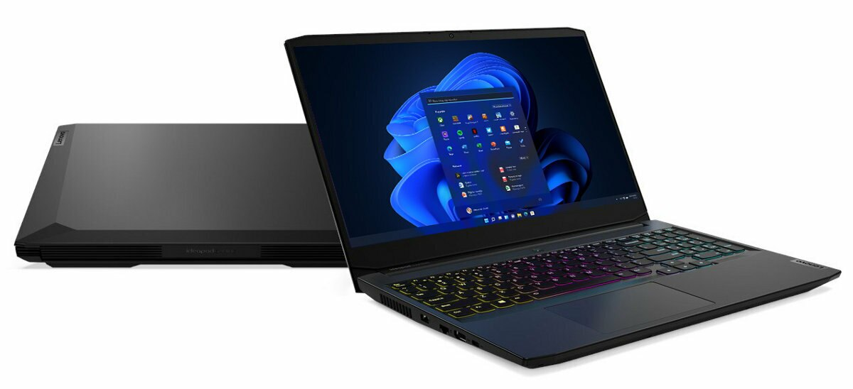 Laptop z podświetlonym ekranem i pokrywą innego laptopa obok.