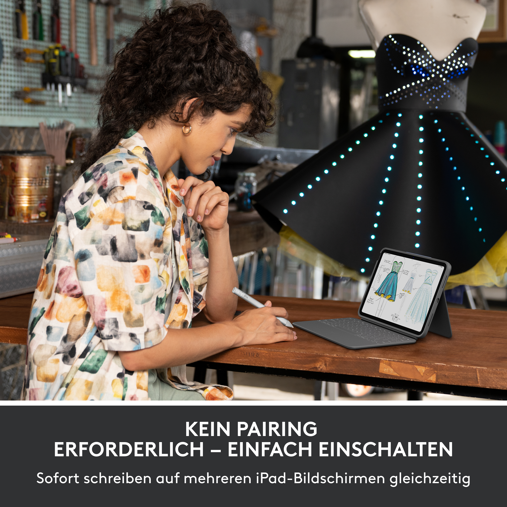 Eine Frau betrachtet ein Tablet, das mit einer Tastatur verbunden ist, mit einem stilvollen Kleid im Hintergrund.