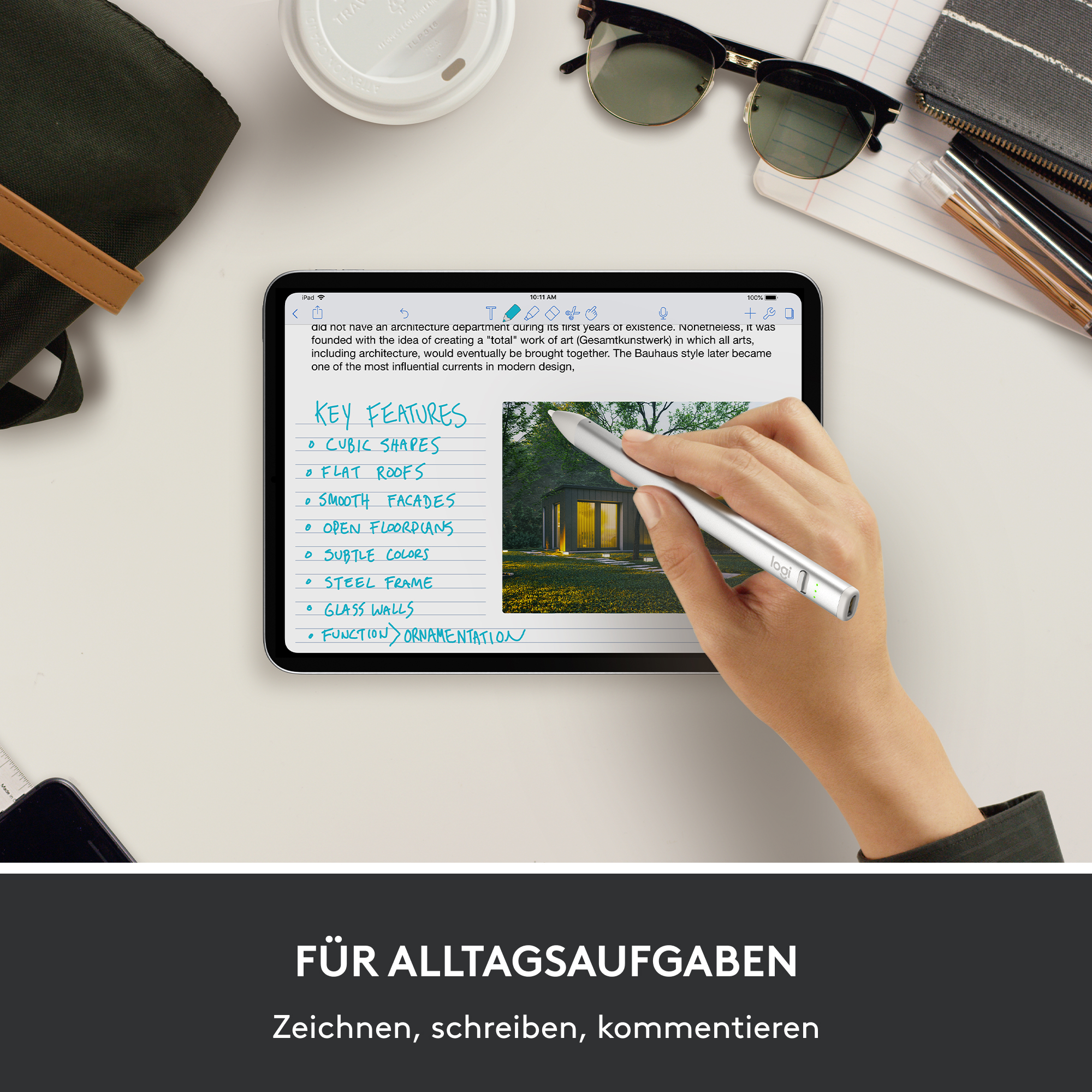 Hand hält Stift, berührt Tablet-Bildschirm mit Notizen zu Schlüsselfunktionen.