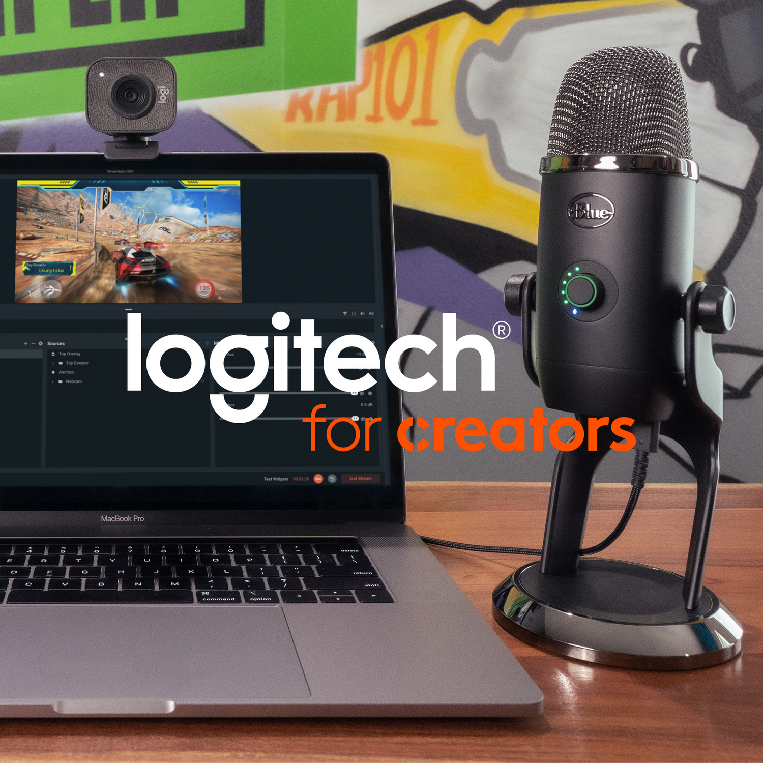Laptop with webcam and microphone. Text: Logitech for creators. Graffiti in the background.