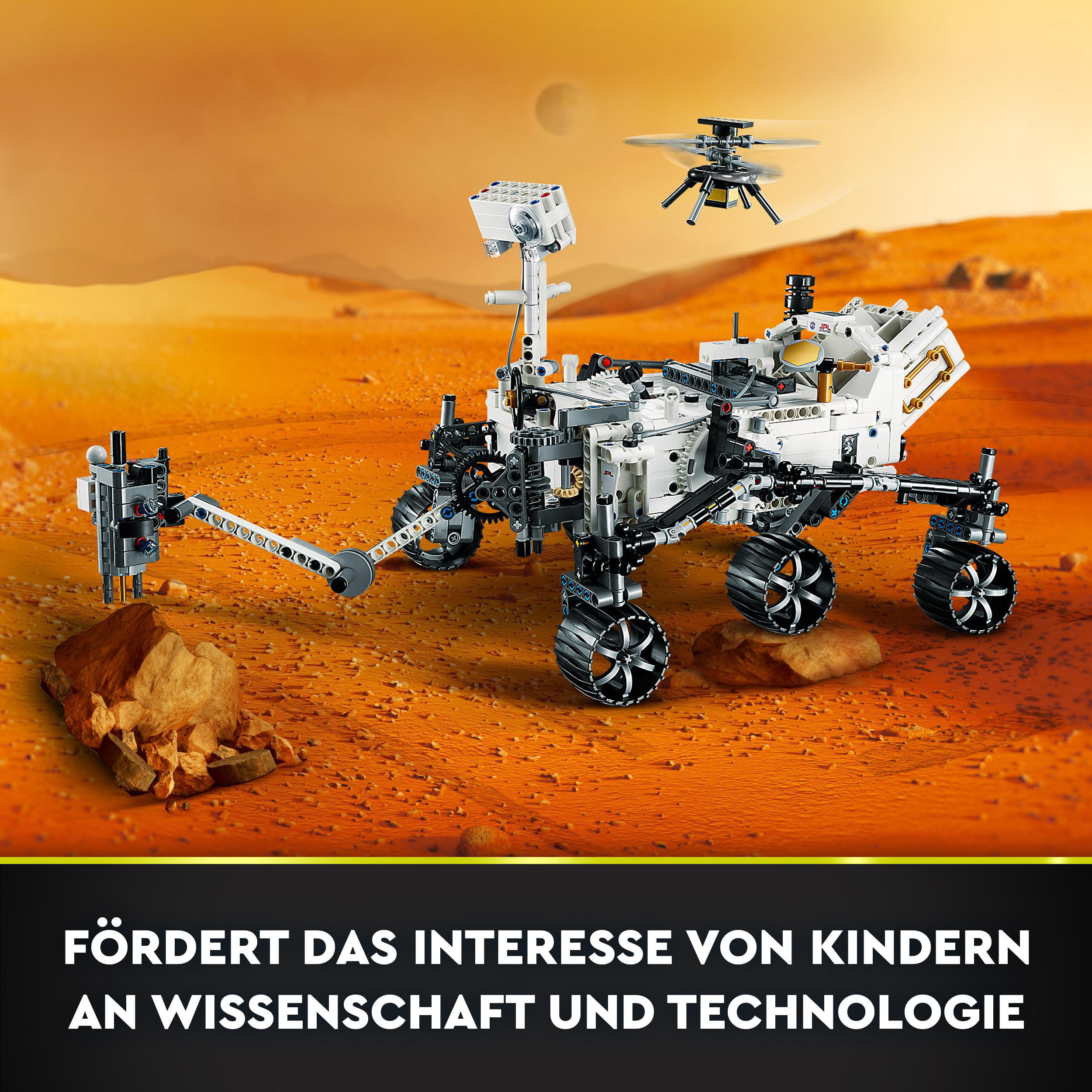 Lego Mars-Rover mit einer kleinen Drohne. Die Szene spielt auf einer rötlichen Planetenoberfläche mit Text unten.