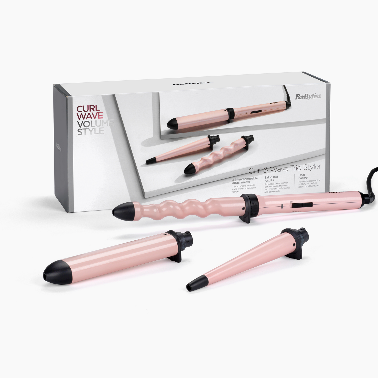 Roze krultangset met verwisselbare opzetstukken en een doos.