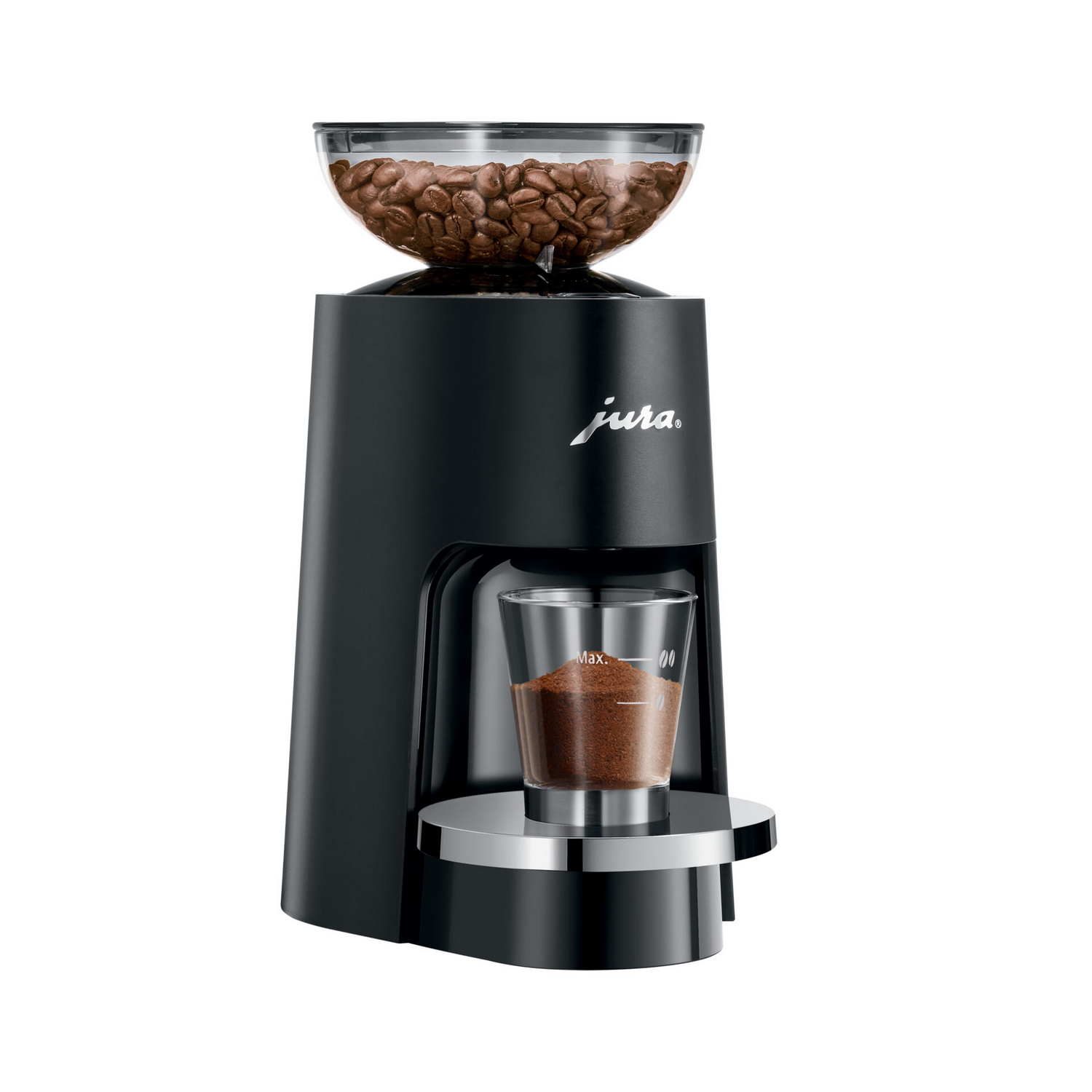 Black Jura coffee grinder with coffee beans in a clear top container. Ground coffee in a glass.