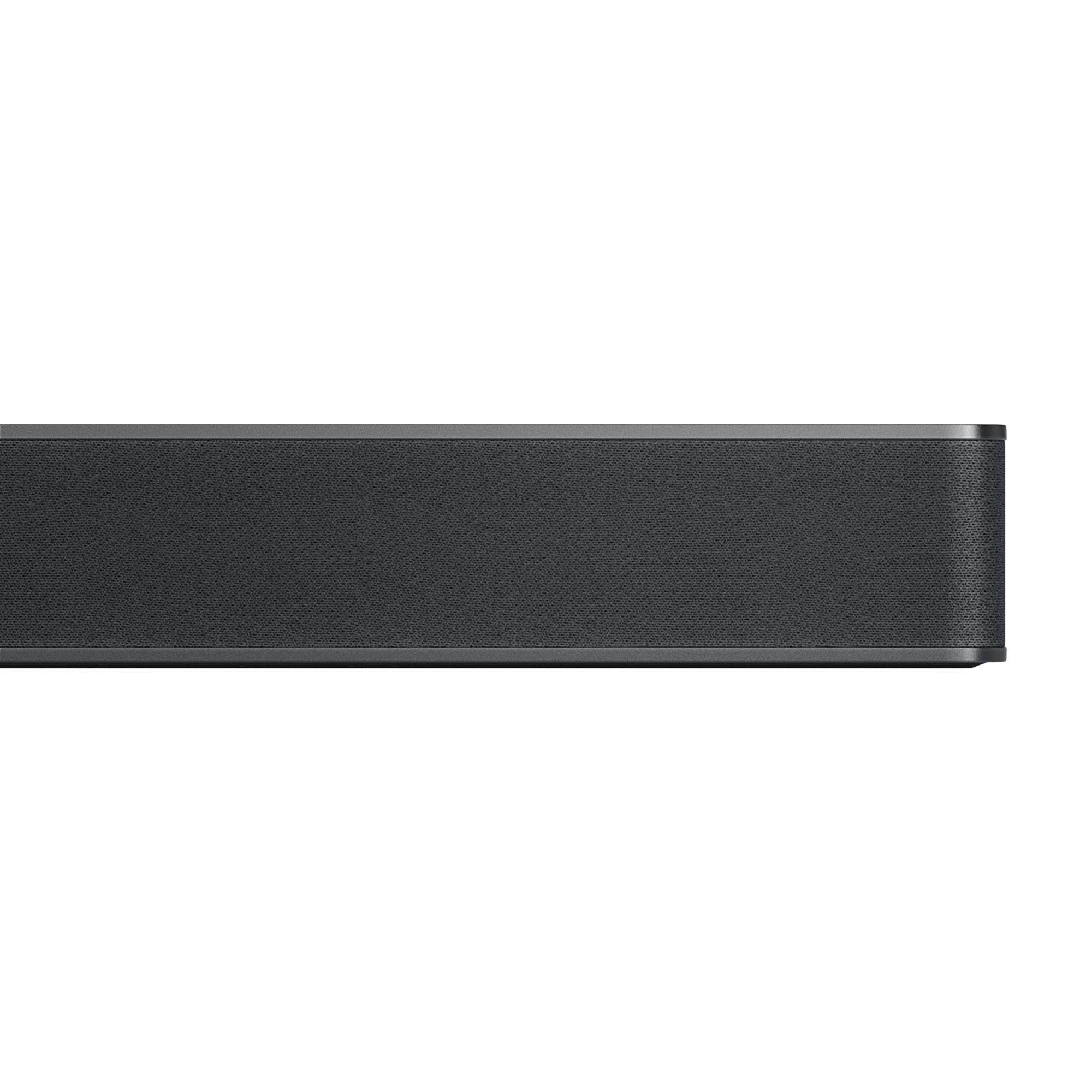 Una barra de sonido larga y negra con una cubierta de altavoz de malla.