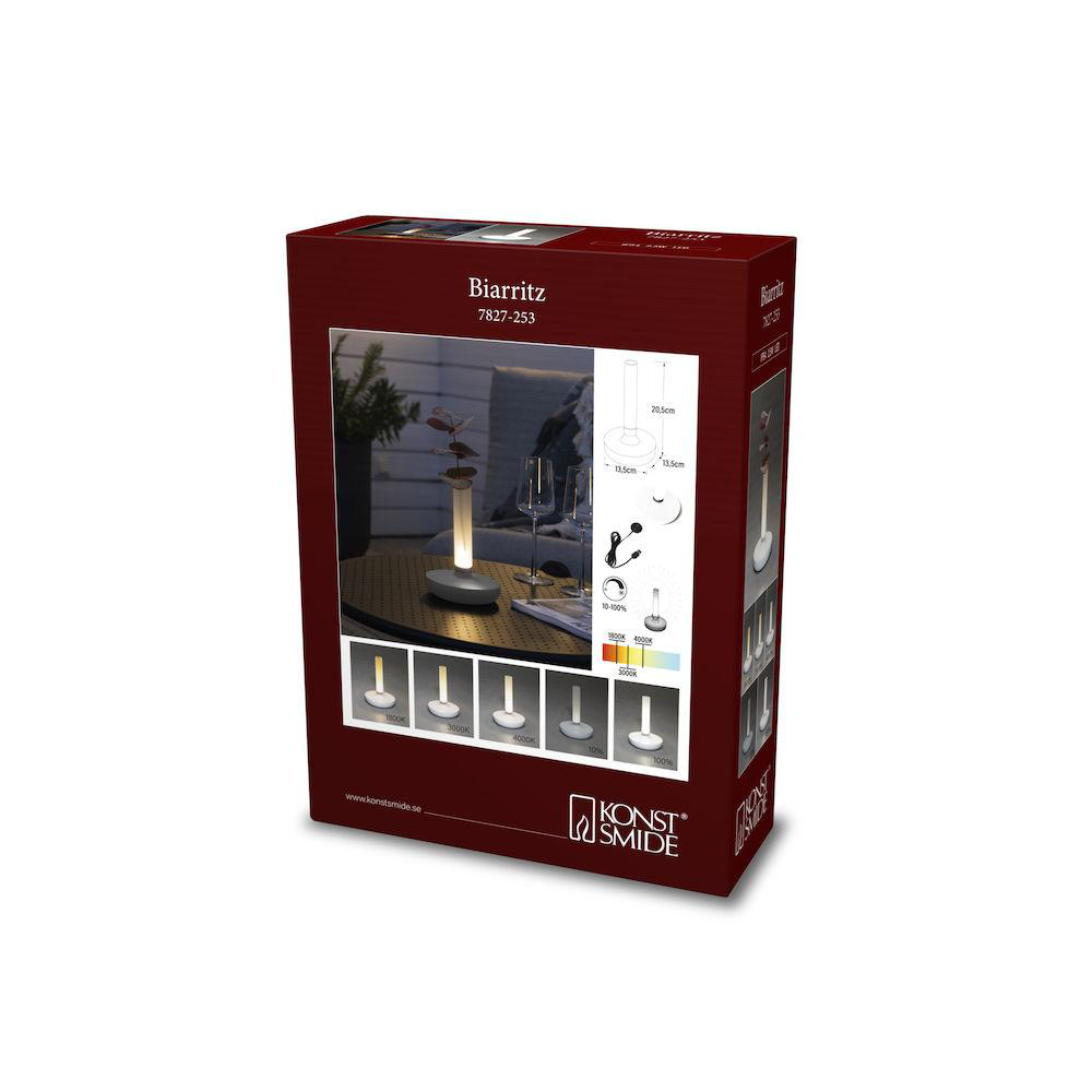 Verpackte Tischlampe mit Diagrammen und Produktinformationen.