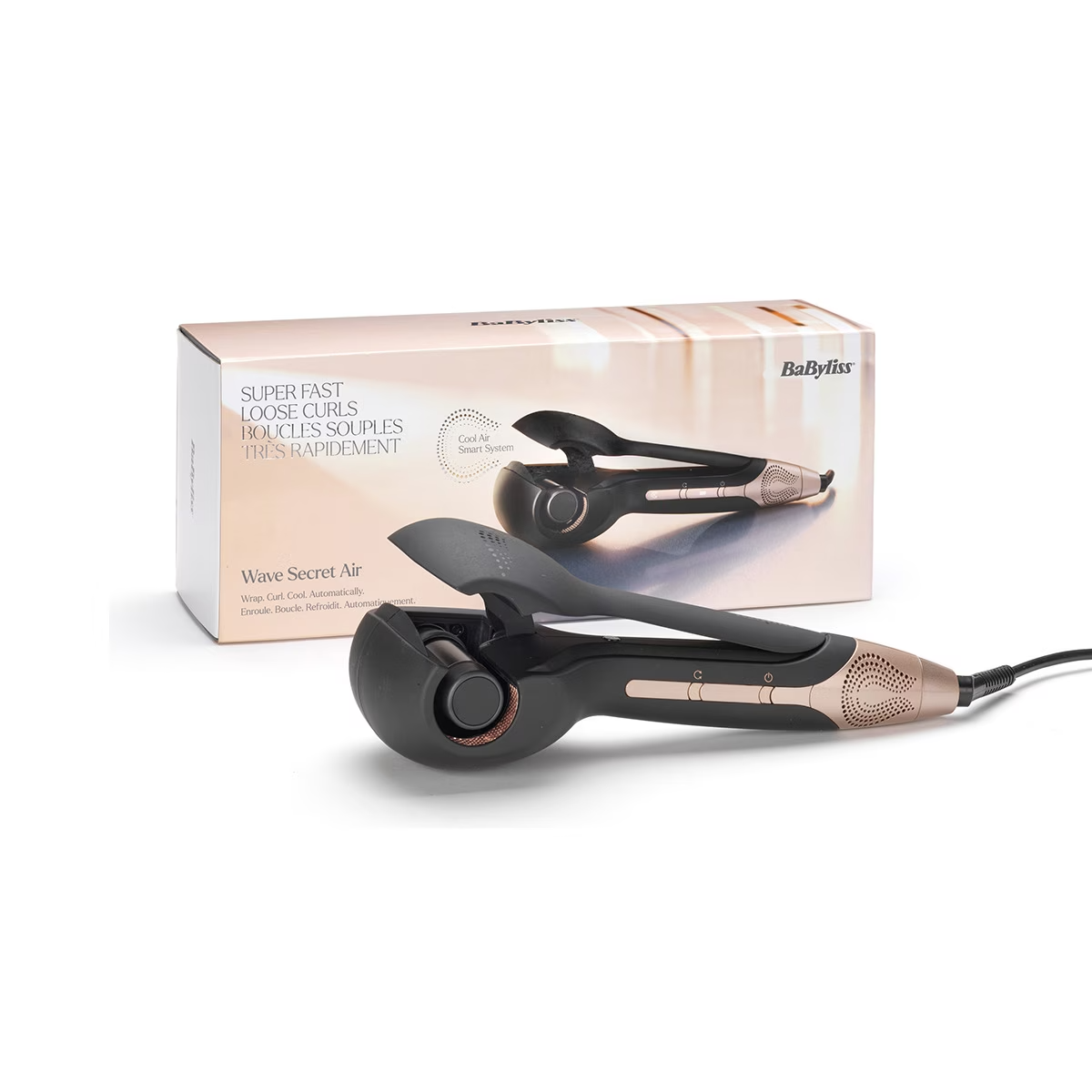 Herramienta para peinar el cabello con una caja detrás. Es negro y dorado.