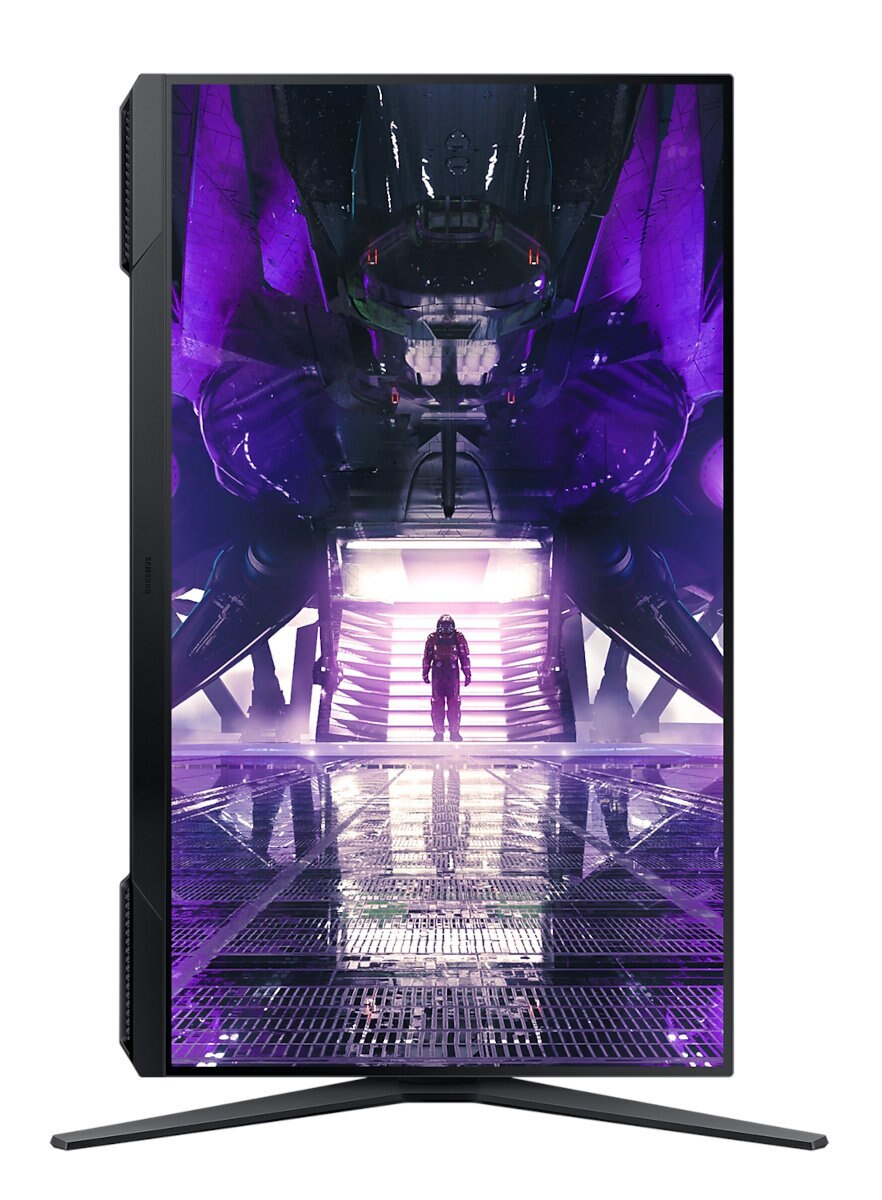 Monitor pokazuje scenę sci-fi z postacią w kombinezonie w fioletowo-czarnej scenerii.