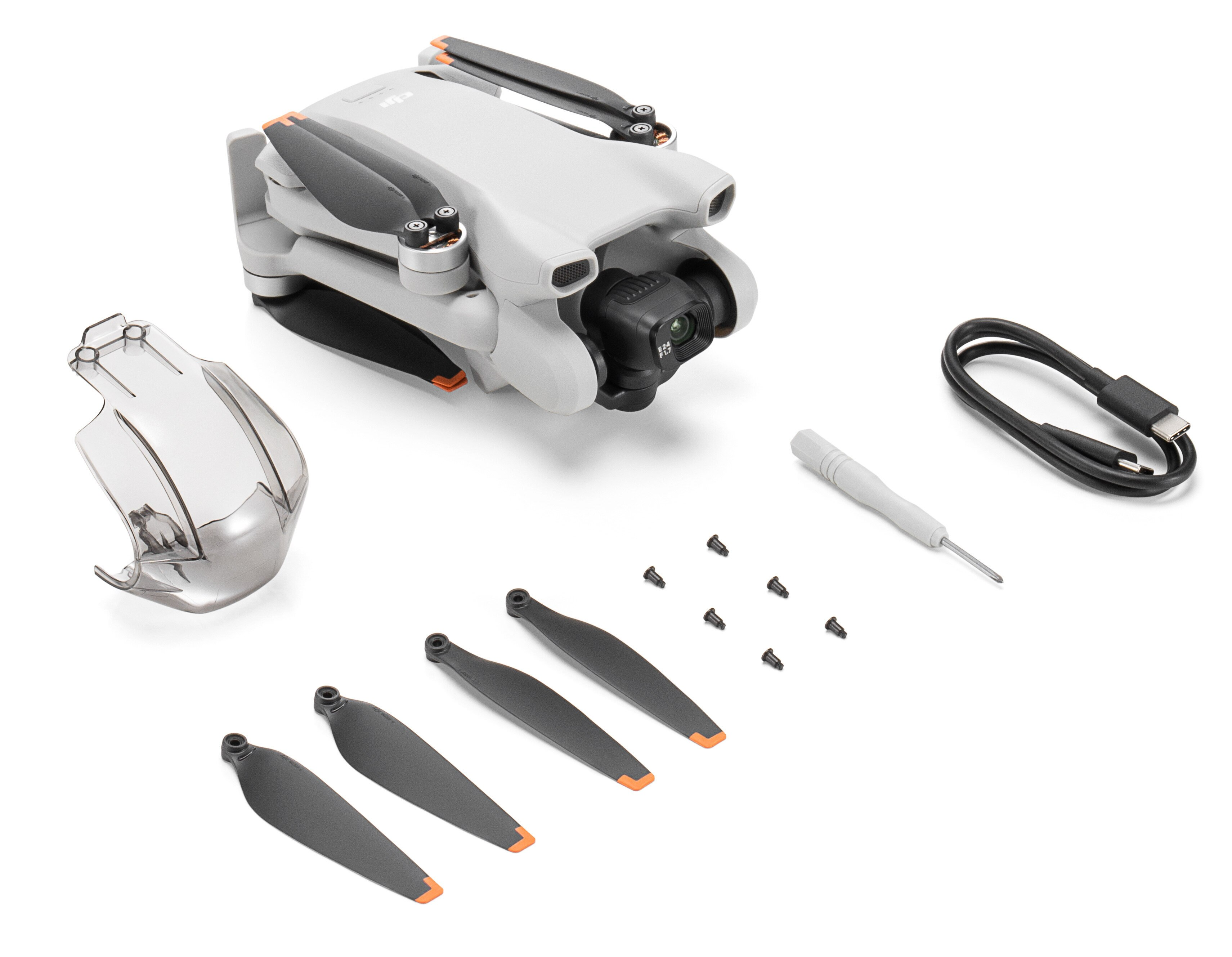 Zestaw drona DJI Mini 3 Pro. Zawiera drona, zapasowe śmigła, śrubokręt i inne akcesoria.