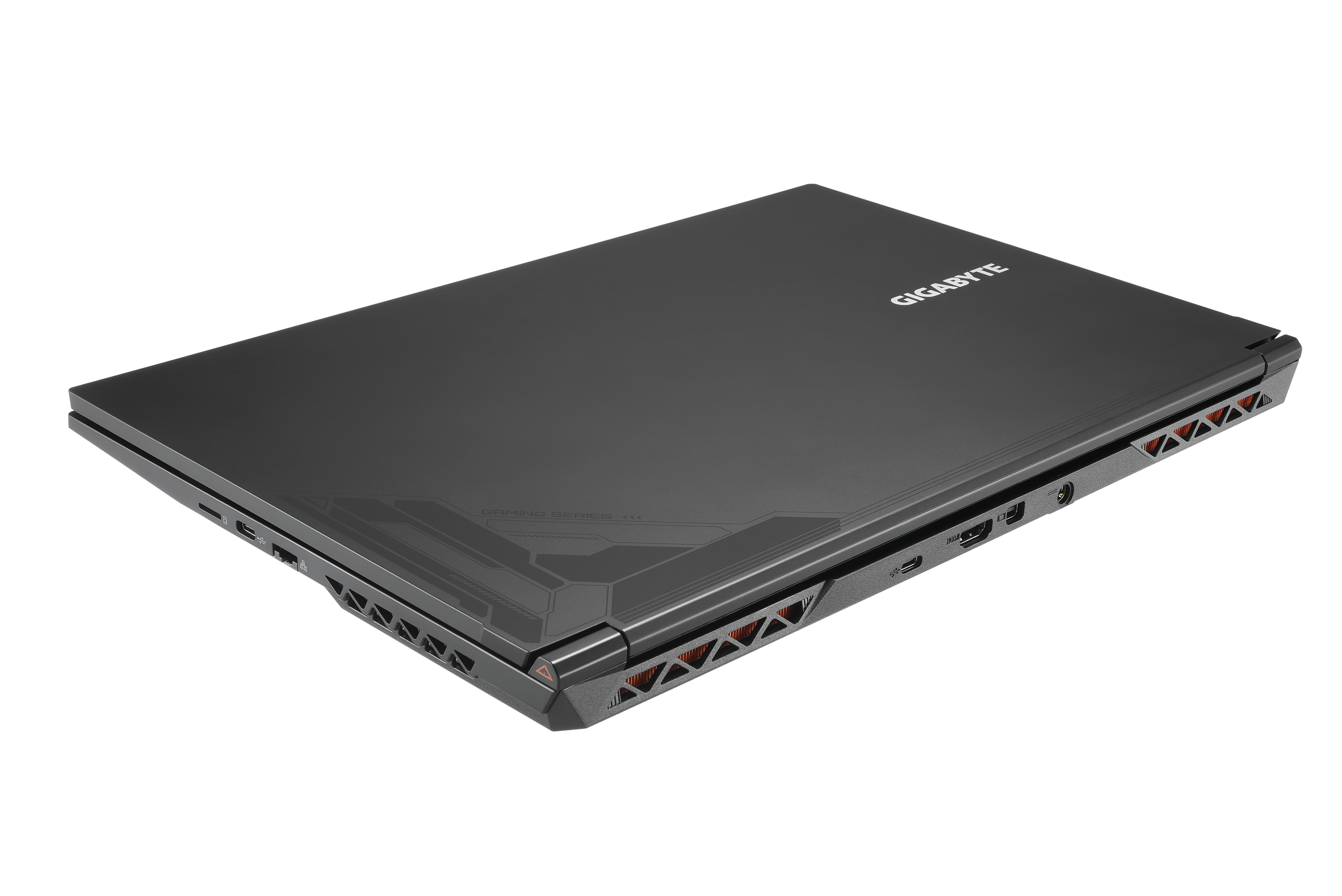 Ein geschlossener schwarzer Laptop von Gigabyte. Er liegt auf einer weißen Oberfläche.