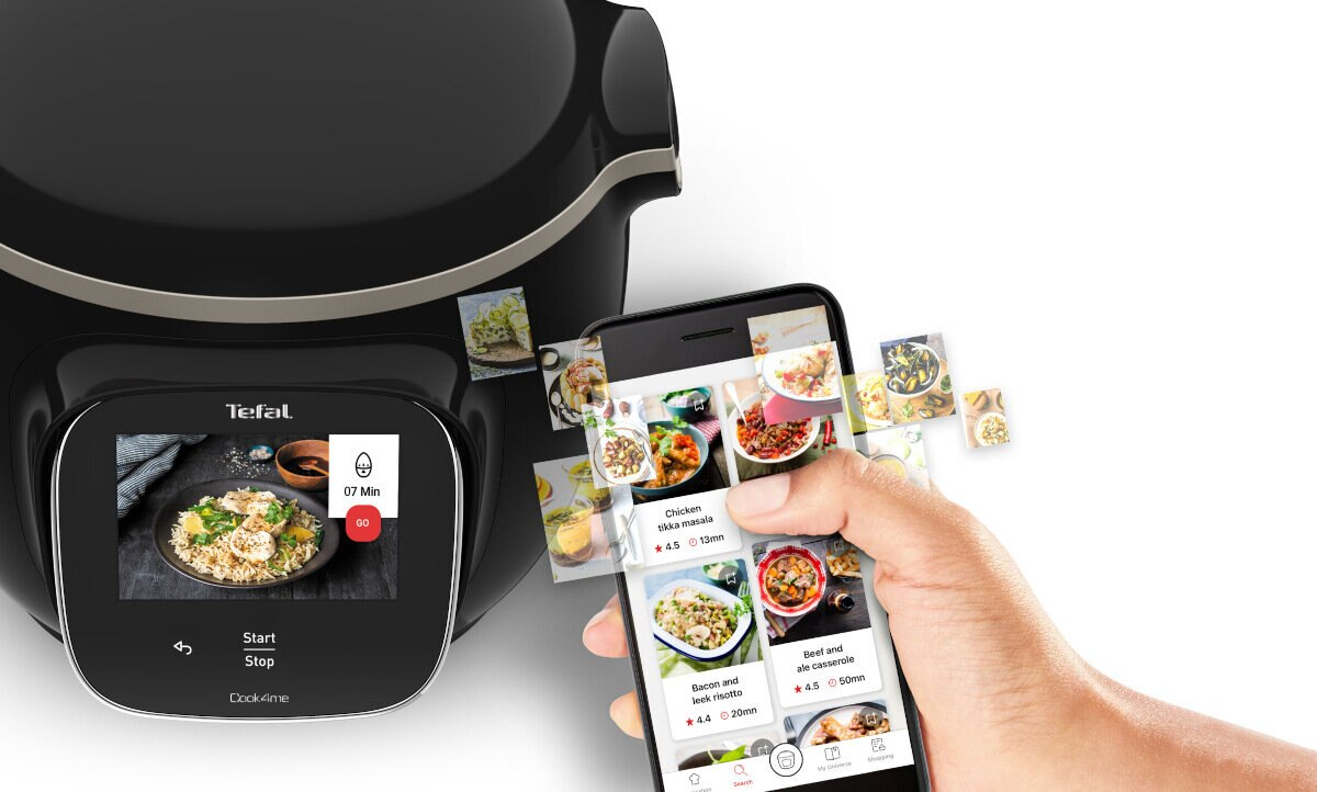 Czarne inteligentne urządzenie do gotowania z telefonem wyświetlającym zdjęcia jedzenia.