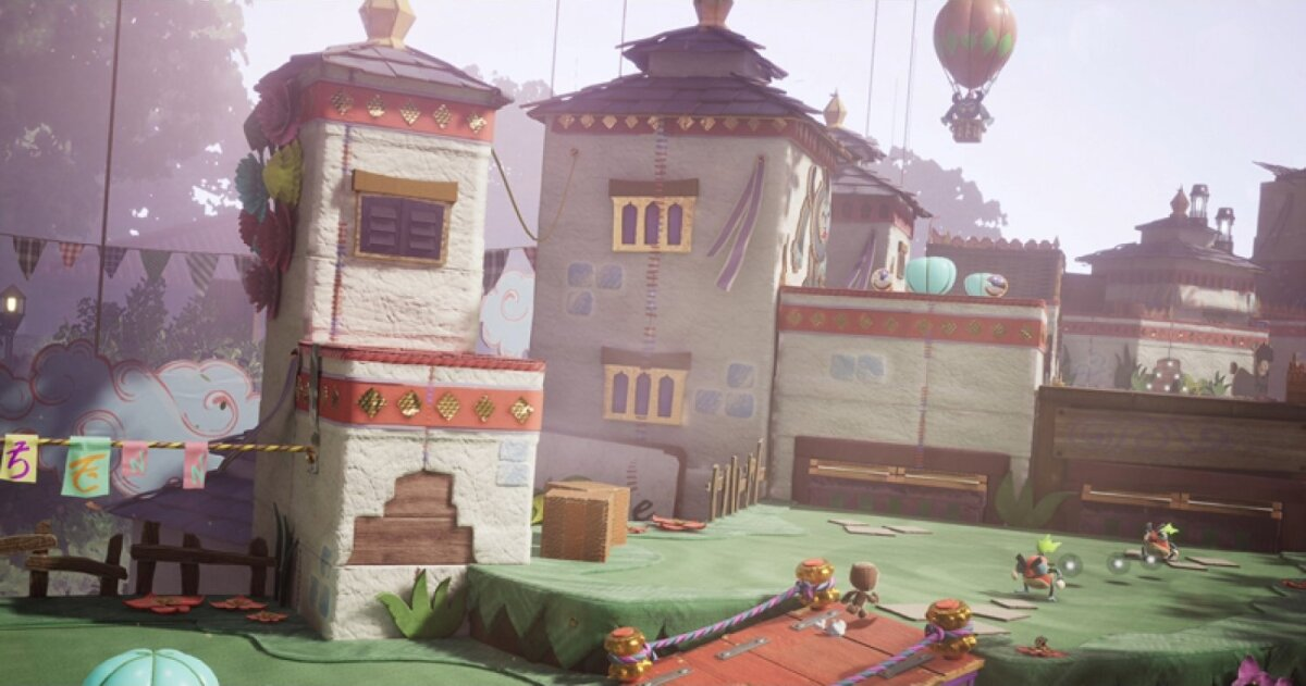 Żywa scena z gry z budynkami z kolorowymi dekoracjami i świąteczną atmosferą.