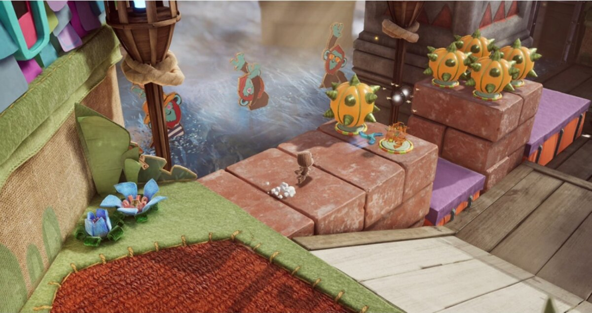 Scena z Little Big Planet. Postać znajduje się na ceglanej platformie. W pobliżu są inne postacie.