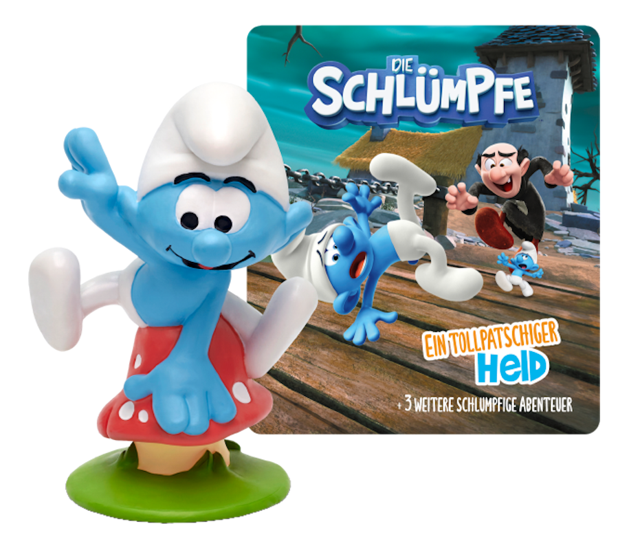 Schlumpf-Figur auf grünem Sockel, mit einem Cartoon-Cover im Hintergrund. Weißer Hintergrund.