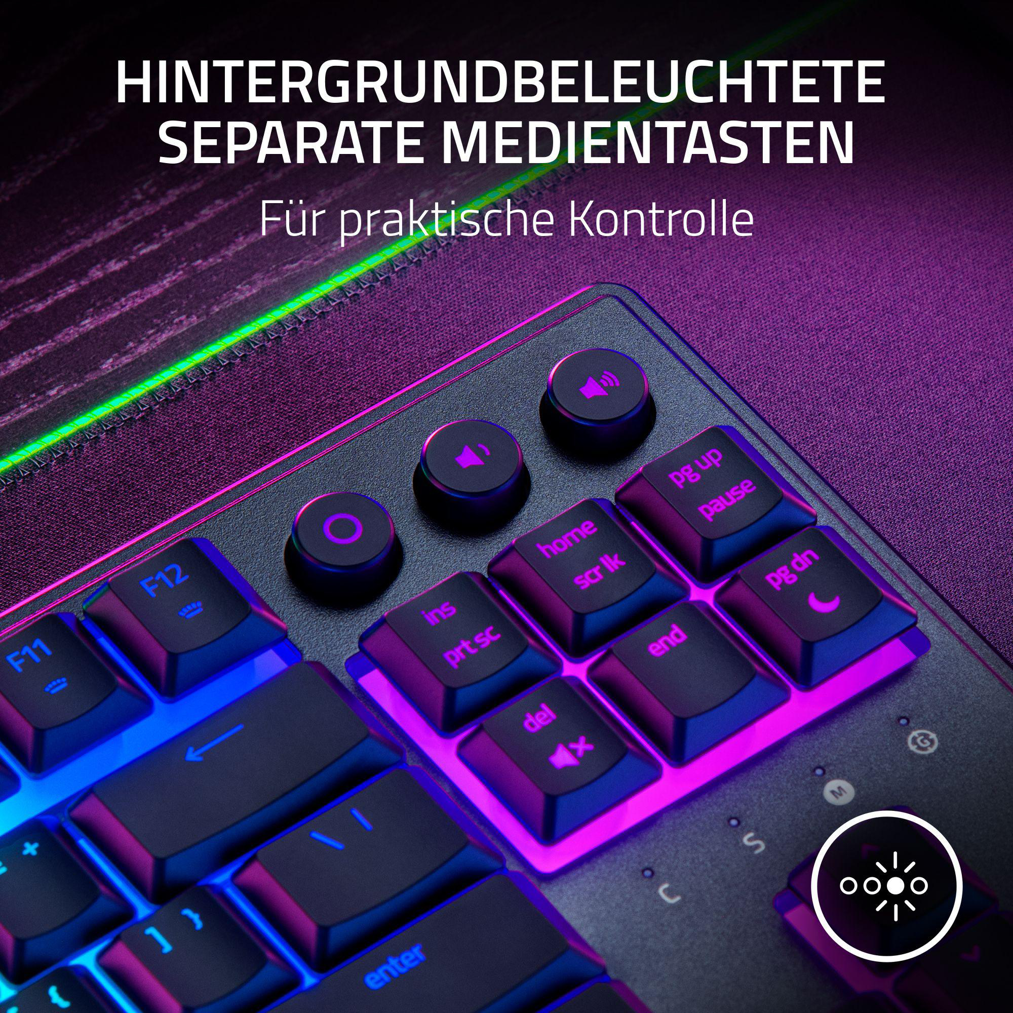 Nahaufnahme einer hintergrundbeleuchteten Tastatur mit Medientasten. Lila und blaue Beleuchtung.