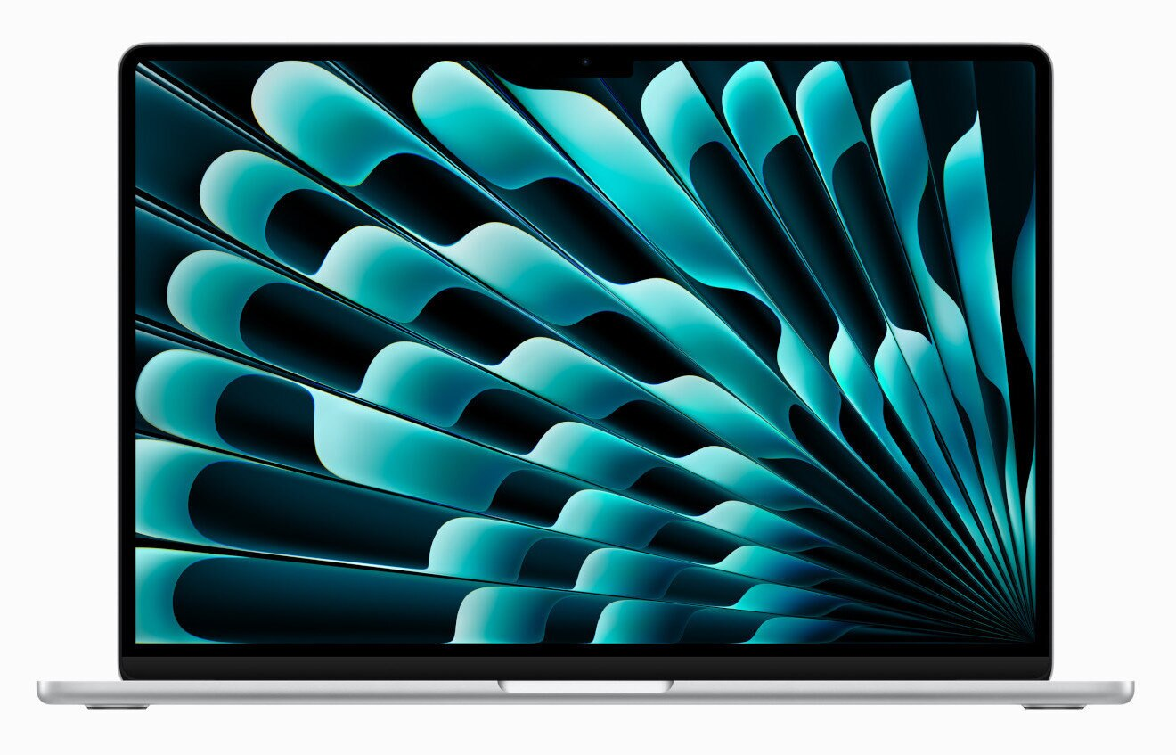 Srebrny laptop z ekranem wyświetlającym turkusowo-niebieski wzór abstrakcyjny.