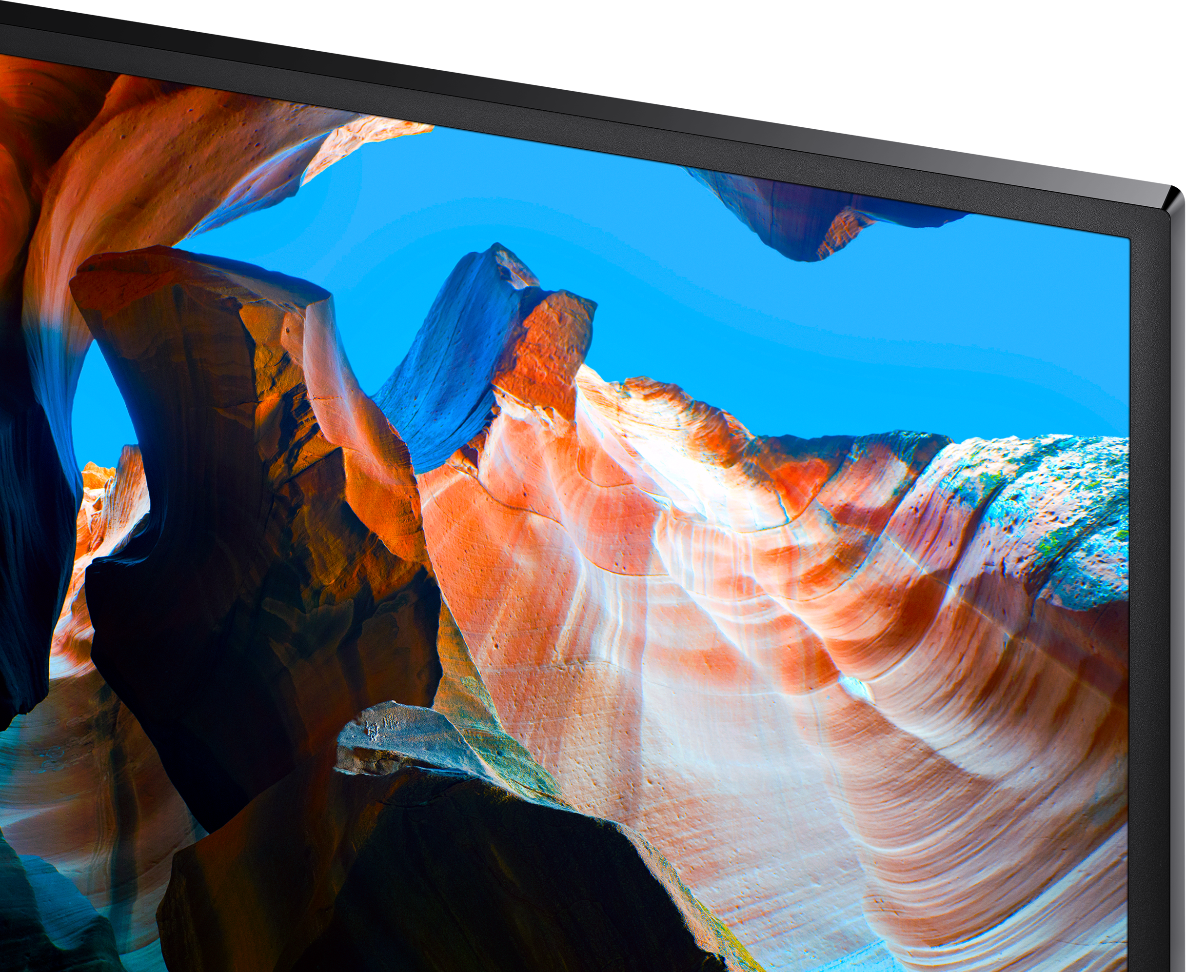 Gros plan sur un écran de télévision montrant un canyon avec des roches rouges et oranges.