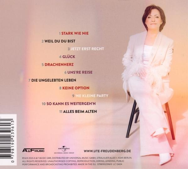 Ein CD-Cover mit Text und einer Frau in einem weißen Anzug.