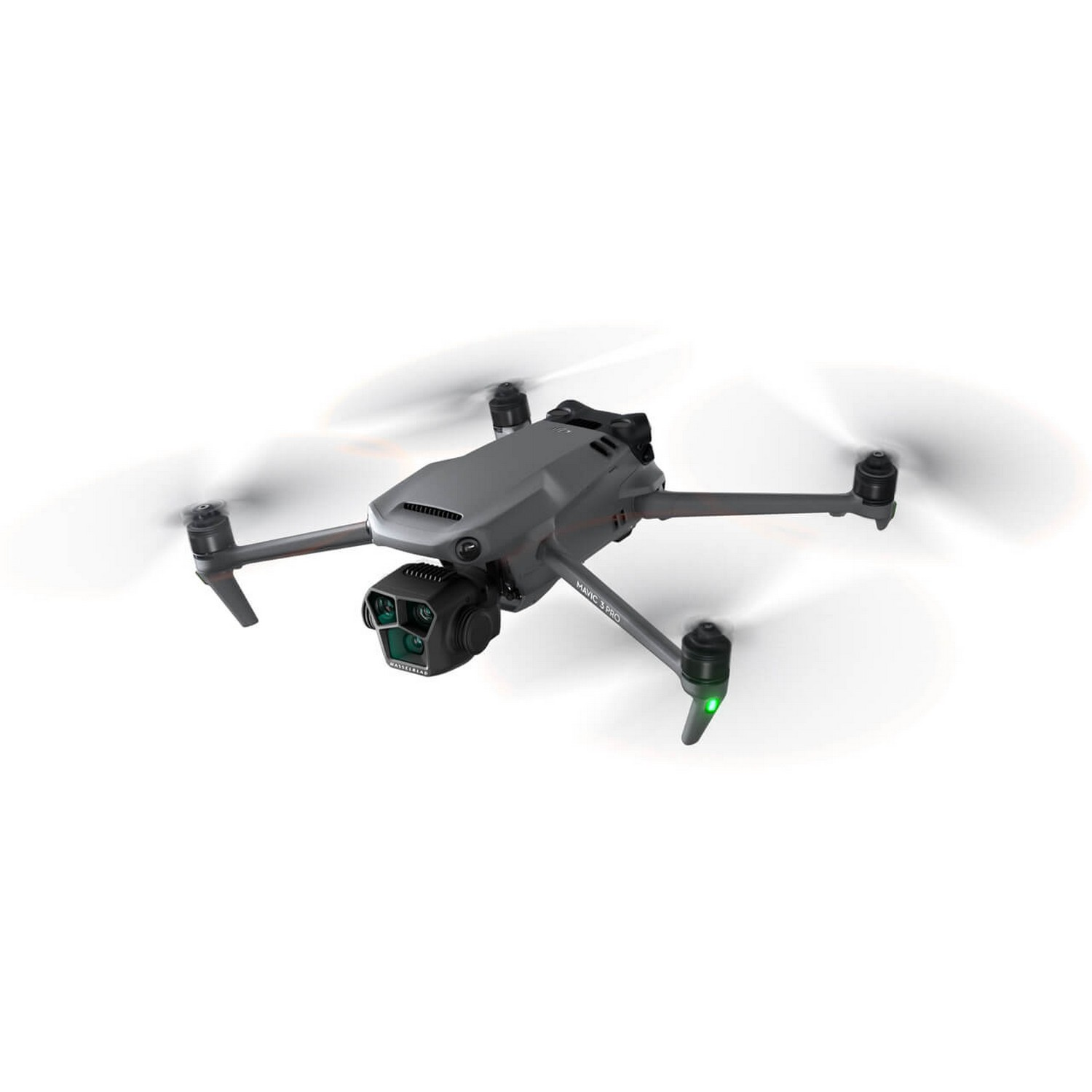 Drone hovering in the air. It is gray, with four propellers and a camera. White background.