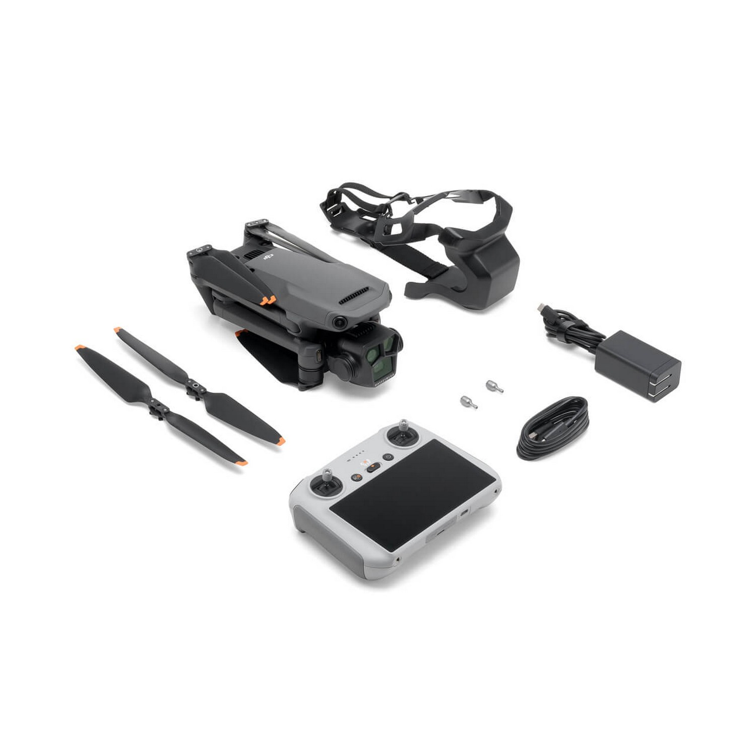 Kit de drone avec hélices, contrôleur, chargeur et étui. Disposé sur fond blanc.