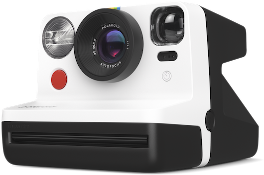 Fehér Polaroid kamera fekete részletekkel, piros gombbal.
