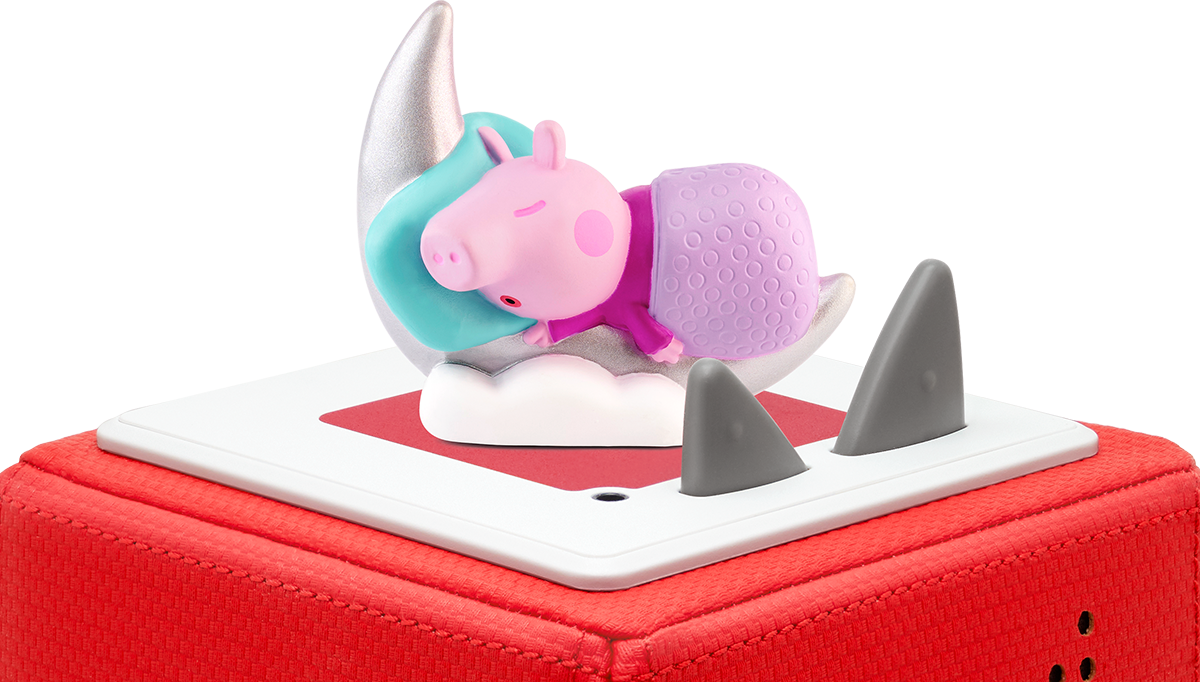 Peppa Wutz Spielzeug auf einer roten Box. Peppa schläft auf einem Mond. Graue Haifischflossen rechts.