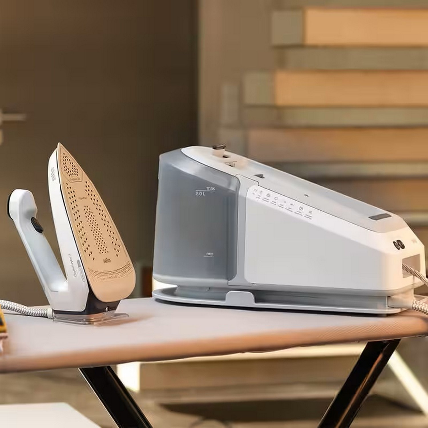 Ironing station with an iron and a steam generator on a white ironing board. The iron is on its stand.