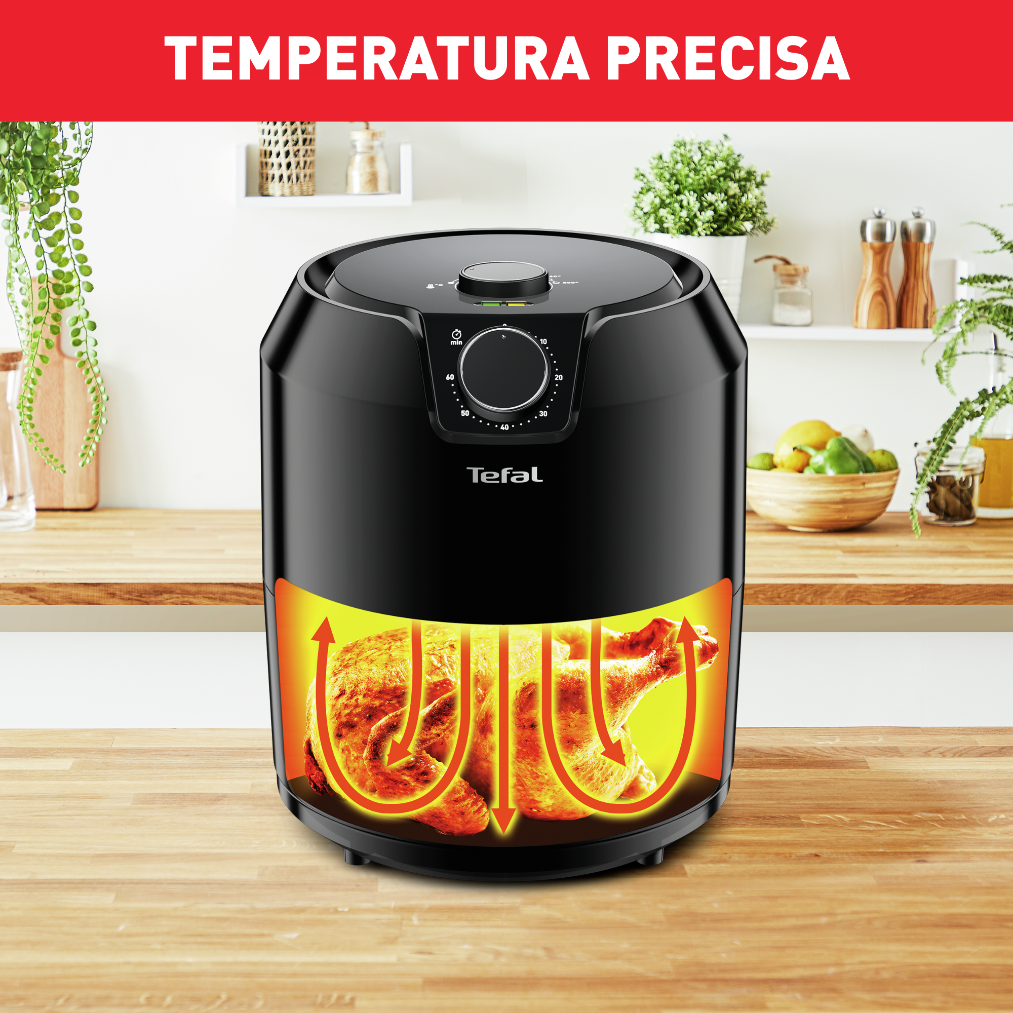 Freidora de aire negra con comida dentro, iluminada con luz naranja.