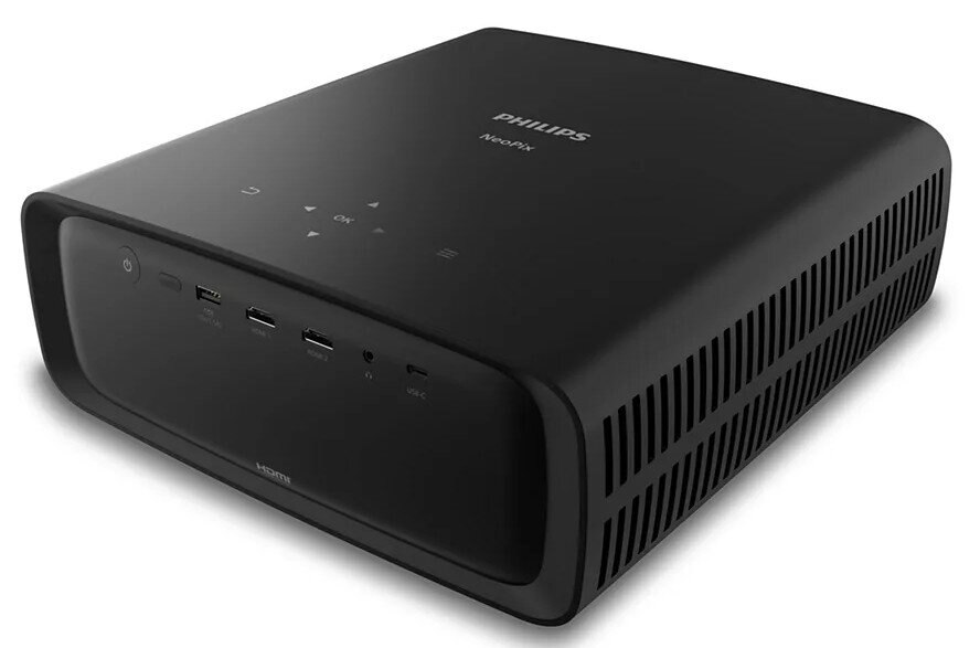 Czarny projektor Philips NeoPix z przyciskami na górze i portami z przodu. Czarna powierzchnia.