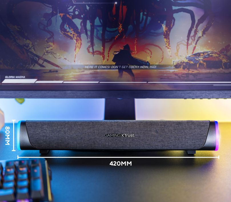 Gaming soundbar képernyővel a háttérben. A soundbar fekete, LED-es lámpákkal.