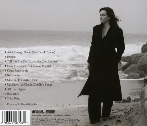 Rückseite einer CD mit Titelliste und einer Frau, die am Strand steht.