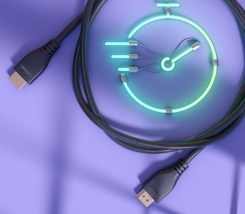Fekete HDMI kábel neon óra grafikával, sebességet és időt sugallva, lila felületen.