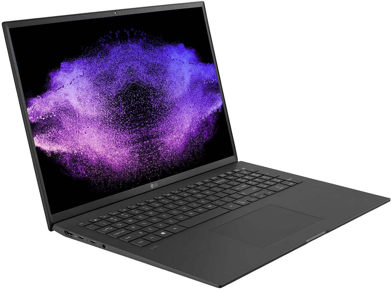 Schwarzer Laptop zeigt lila wolkenartiges Bild. Weißer Hintergrund.