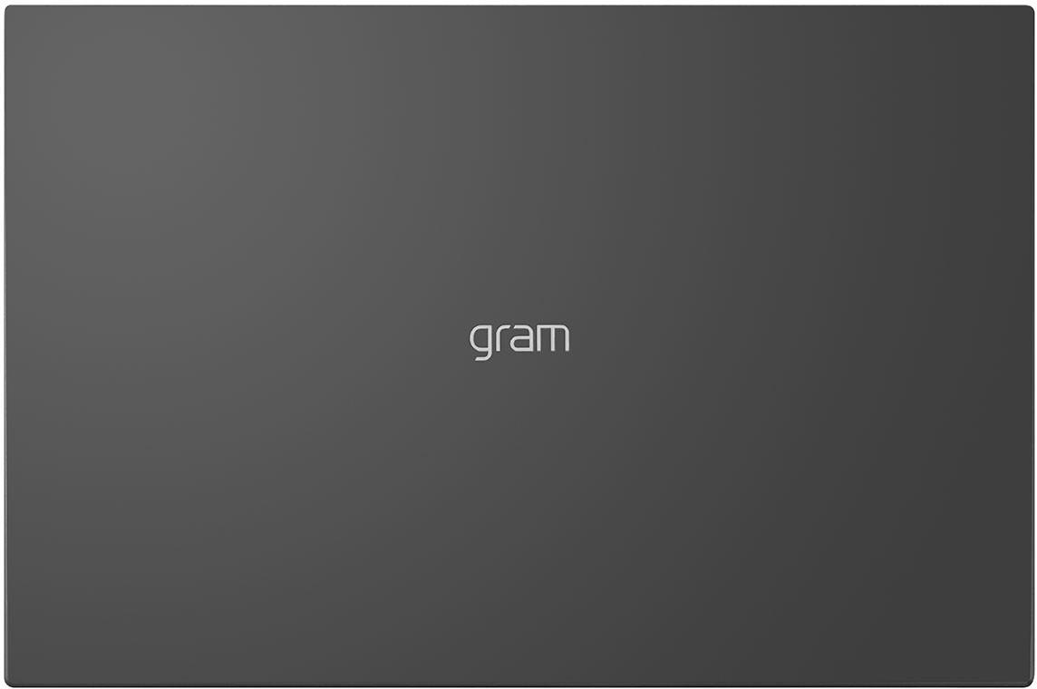 Eine Draufsicht auf einen geschlossenen grauen Laptop mit dem Wort 'gram' in Weiß.