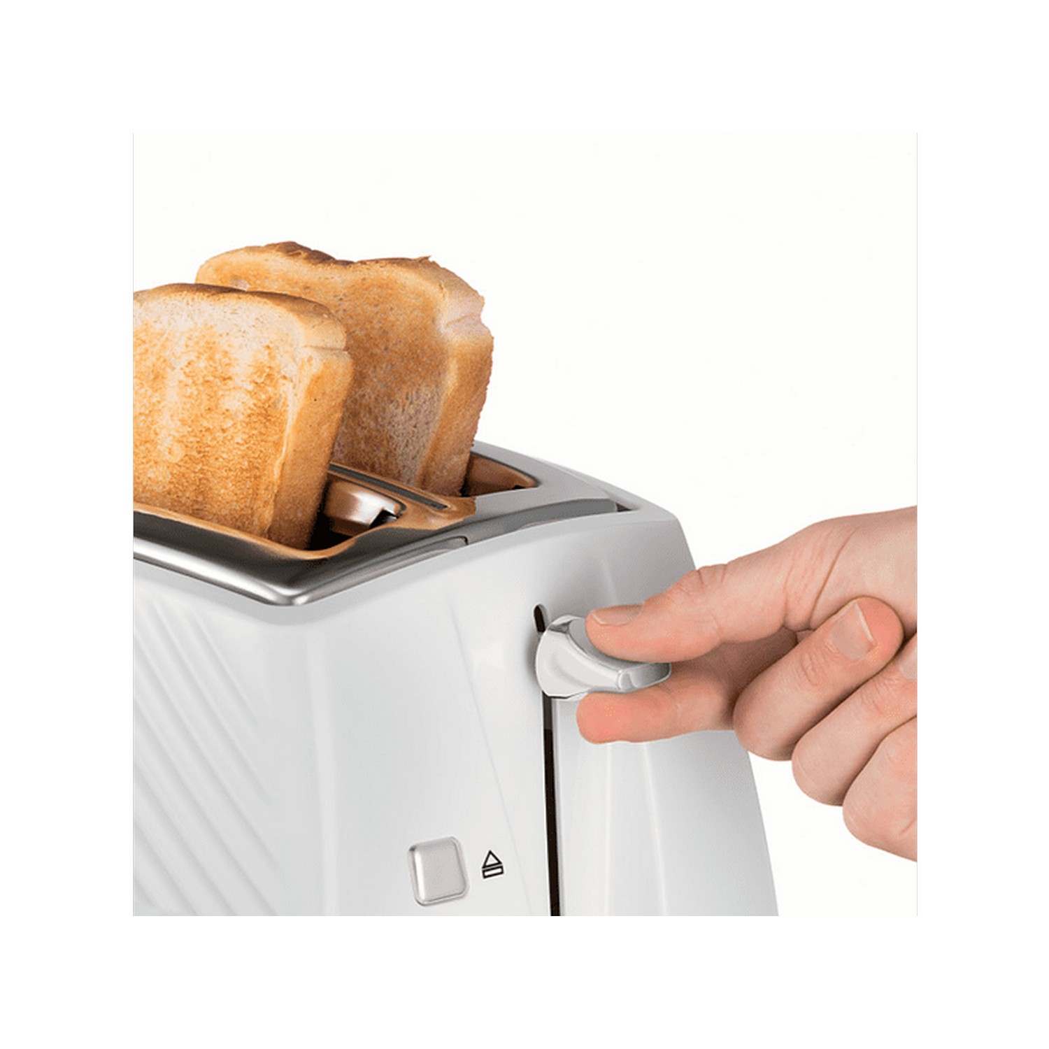 A hand operating a white toaster with two slices of toasted bread.