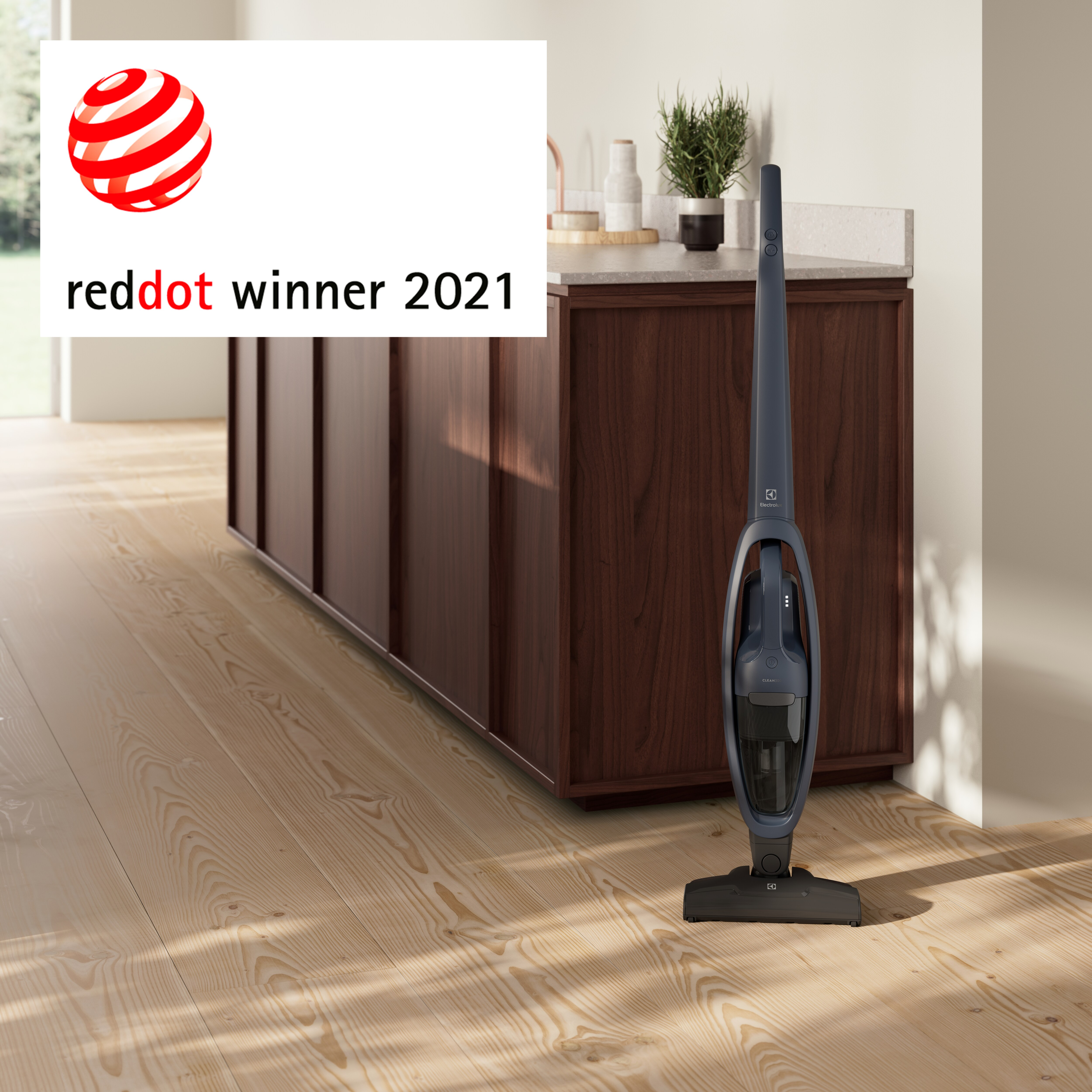 Un aspirapolvere senza fili e il testo 'reddot winner 2021' a sinistra.