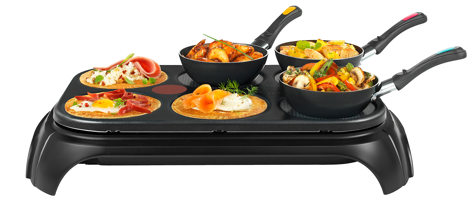Black griddle with various small pans of food, white background.