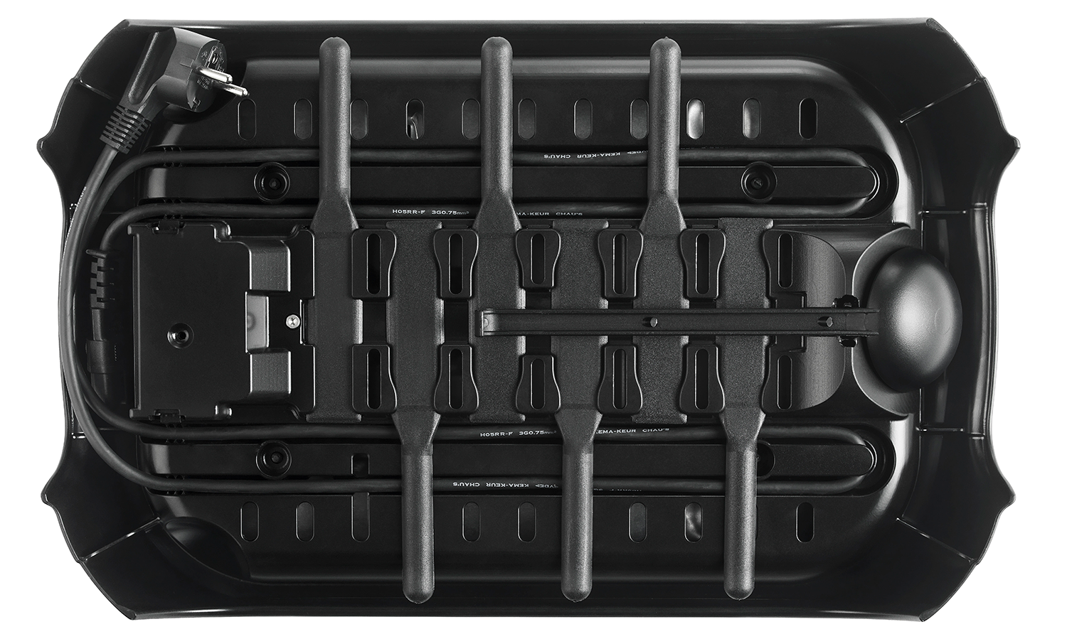 Bottom view of a black device with internal components and a power cable.