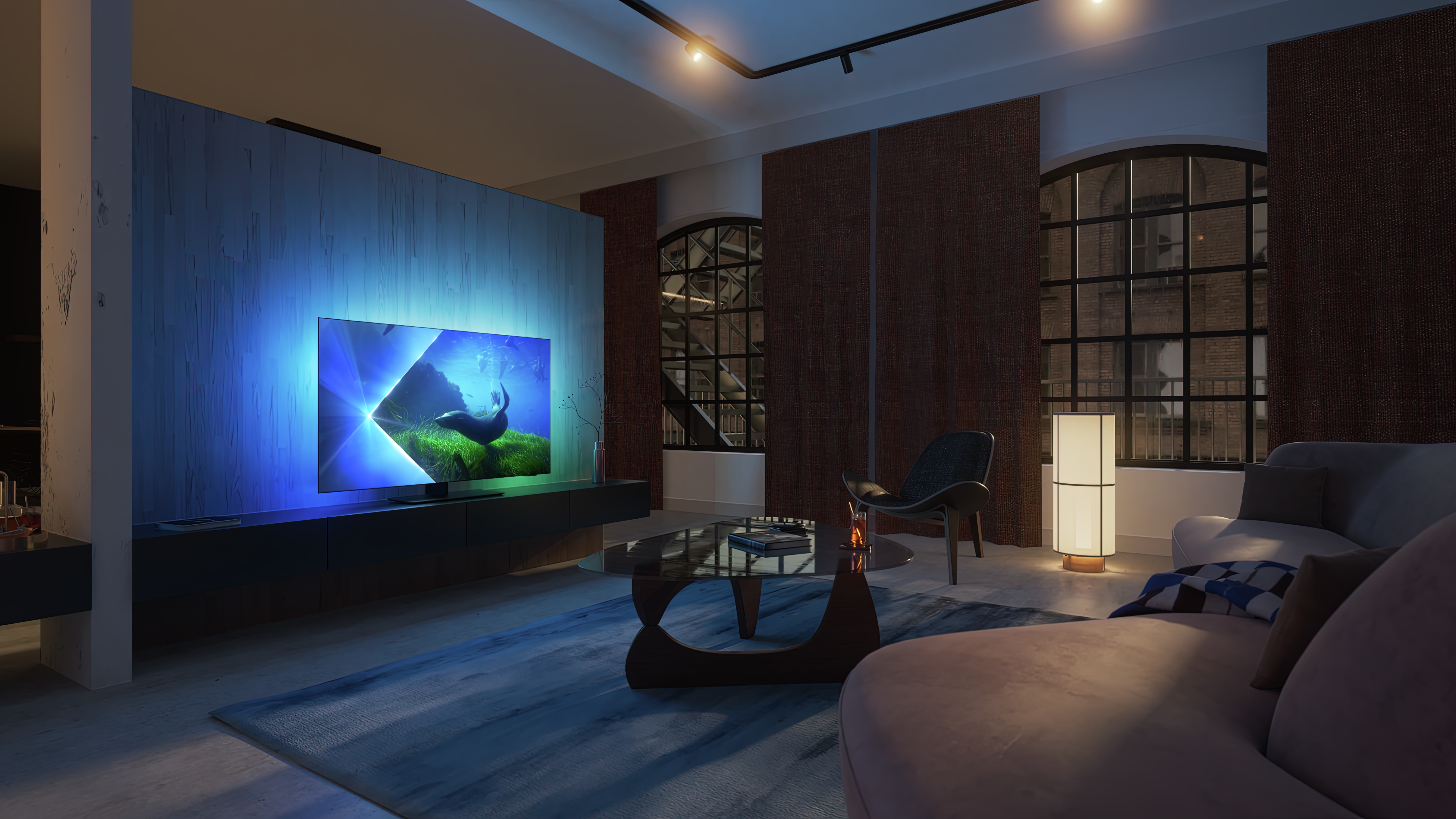 Modernes Wohnzimmer mit beleuchtetem Fernseher, Sofa, Couchtisch und Fenstern.