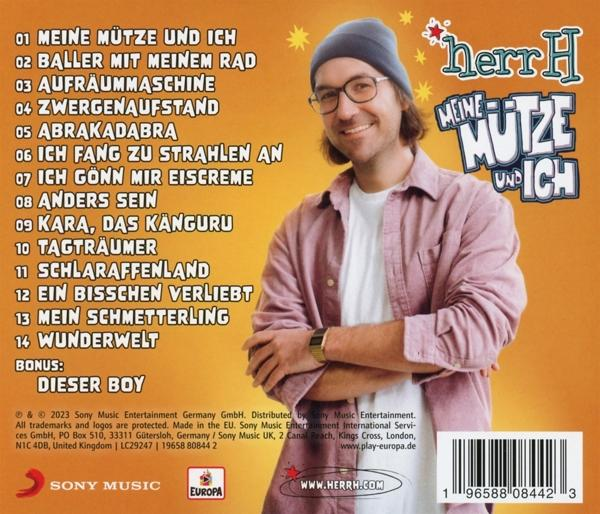 Albumcover mit einem Mann mit Hut, der lächelt. Text auf Deutsch.