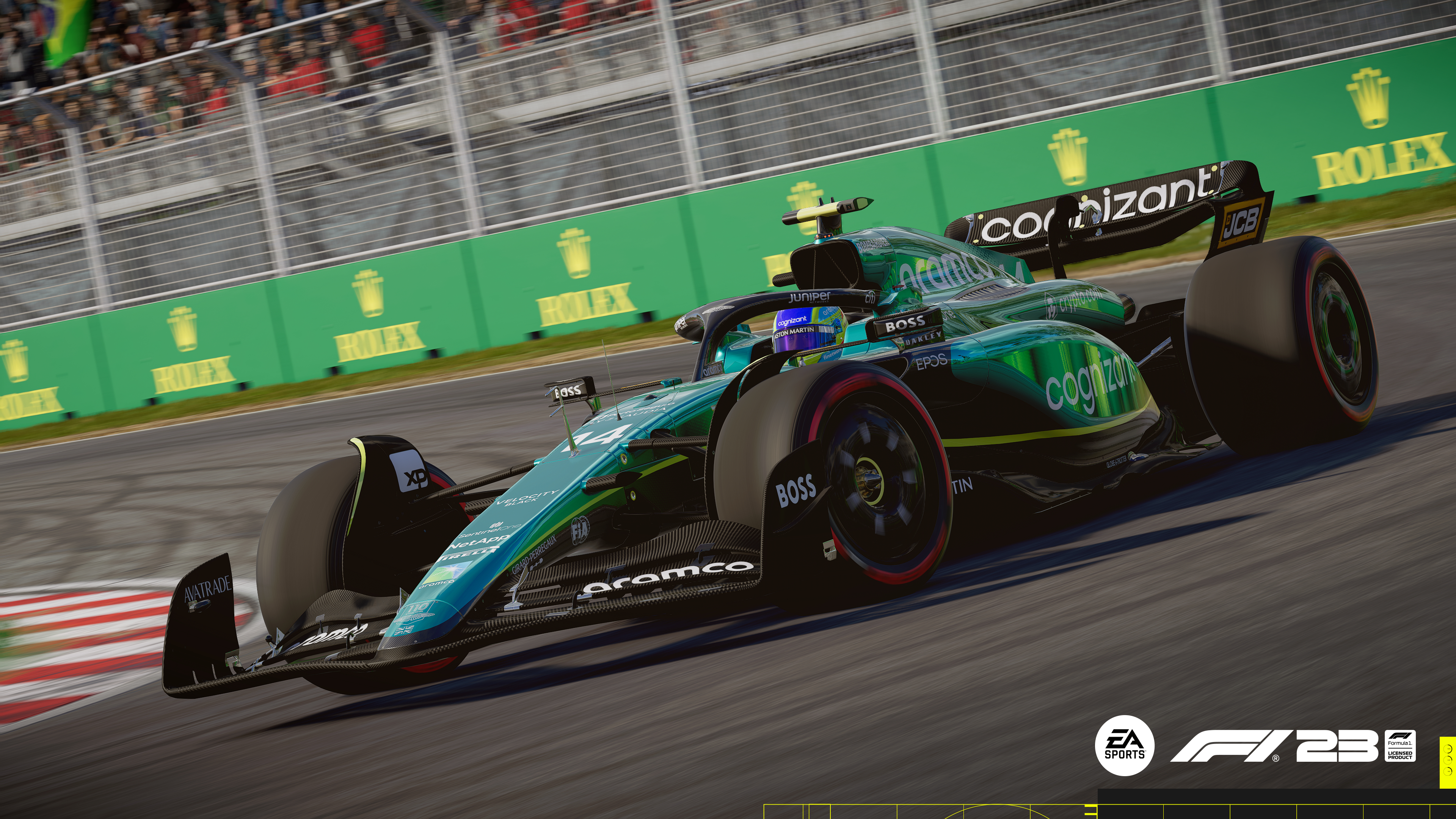 Grünes und schwarzes F1-Auto fährt auf einer Rennstrecke mit Logos, sonniger Tag.
