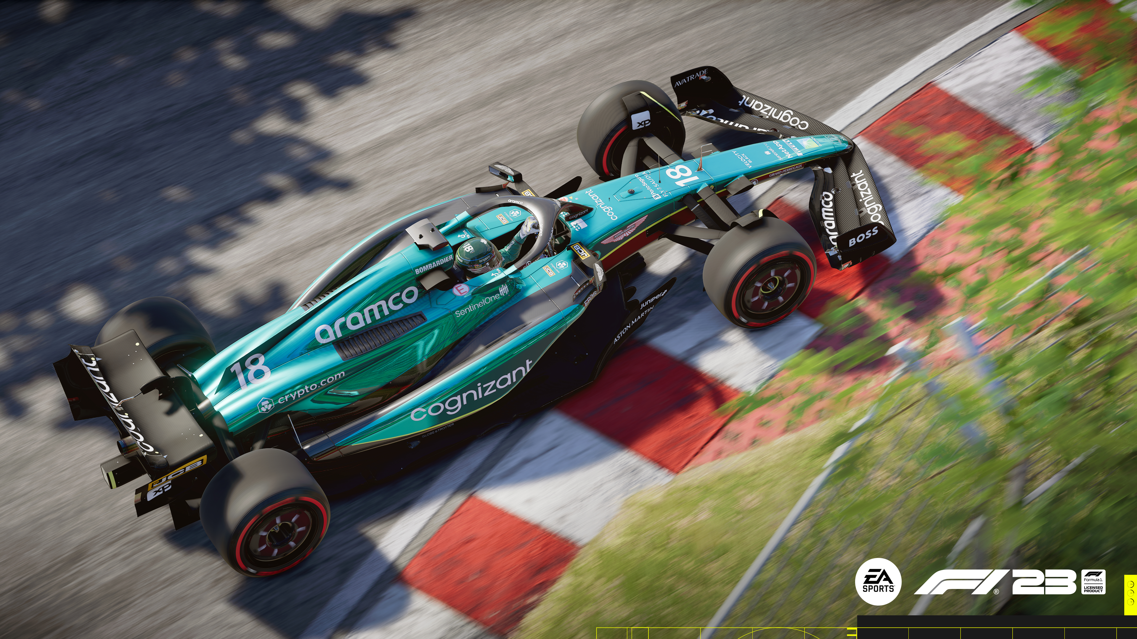 Formel-1-Rennwagen, hellblau und grün, auf einer Rennstrecke mit rot-weißen Barrieren.