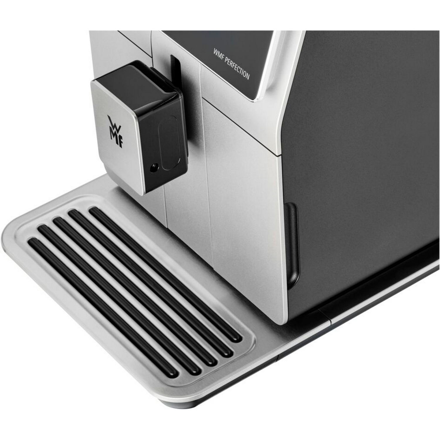 A close-up of a silver and black coffee machine. It has a black spout and a silver tray below.