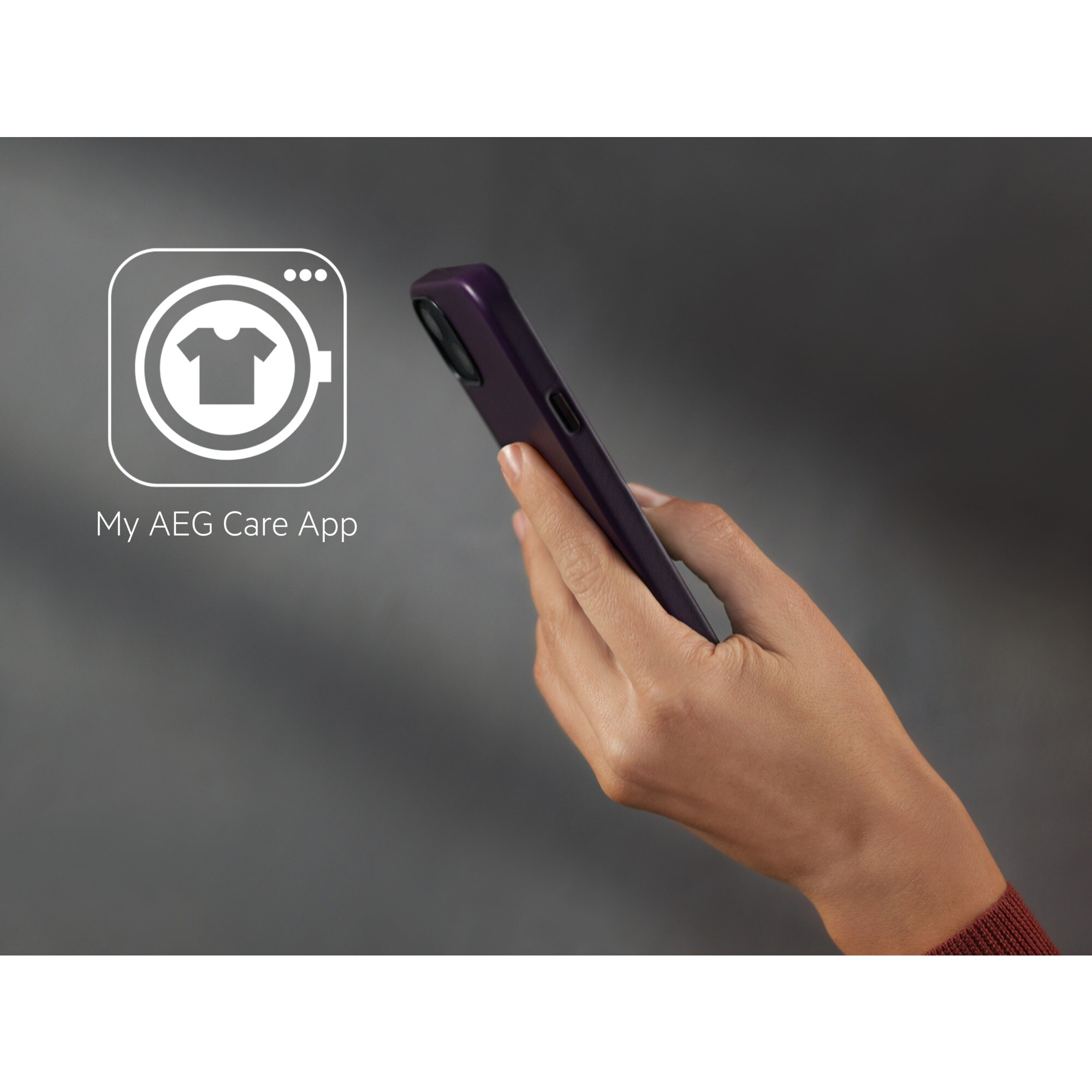 Una mano sosteniendo un teléfono morado junto a un icono de la aplicación de lavadora.