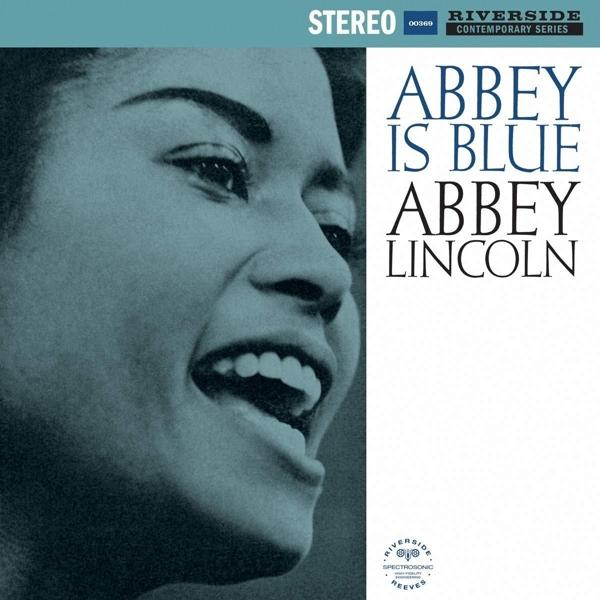 Abbey Lincoln album borítója. Fekete-fehér fotó mosolygó nőről kék háttérrel.