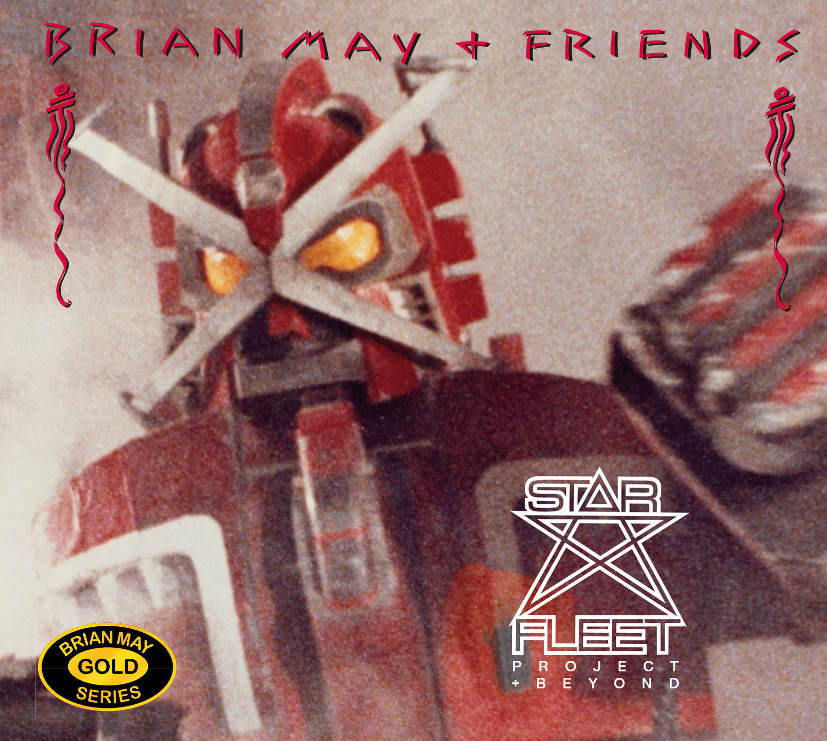 Album borító. Piros robot 'Brian May + Friends' és 'Star Fleet Project' felirattal. Arany sorozat logó.