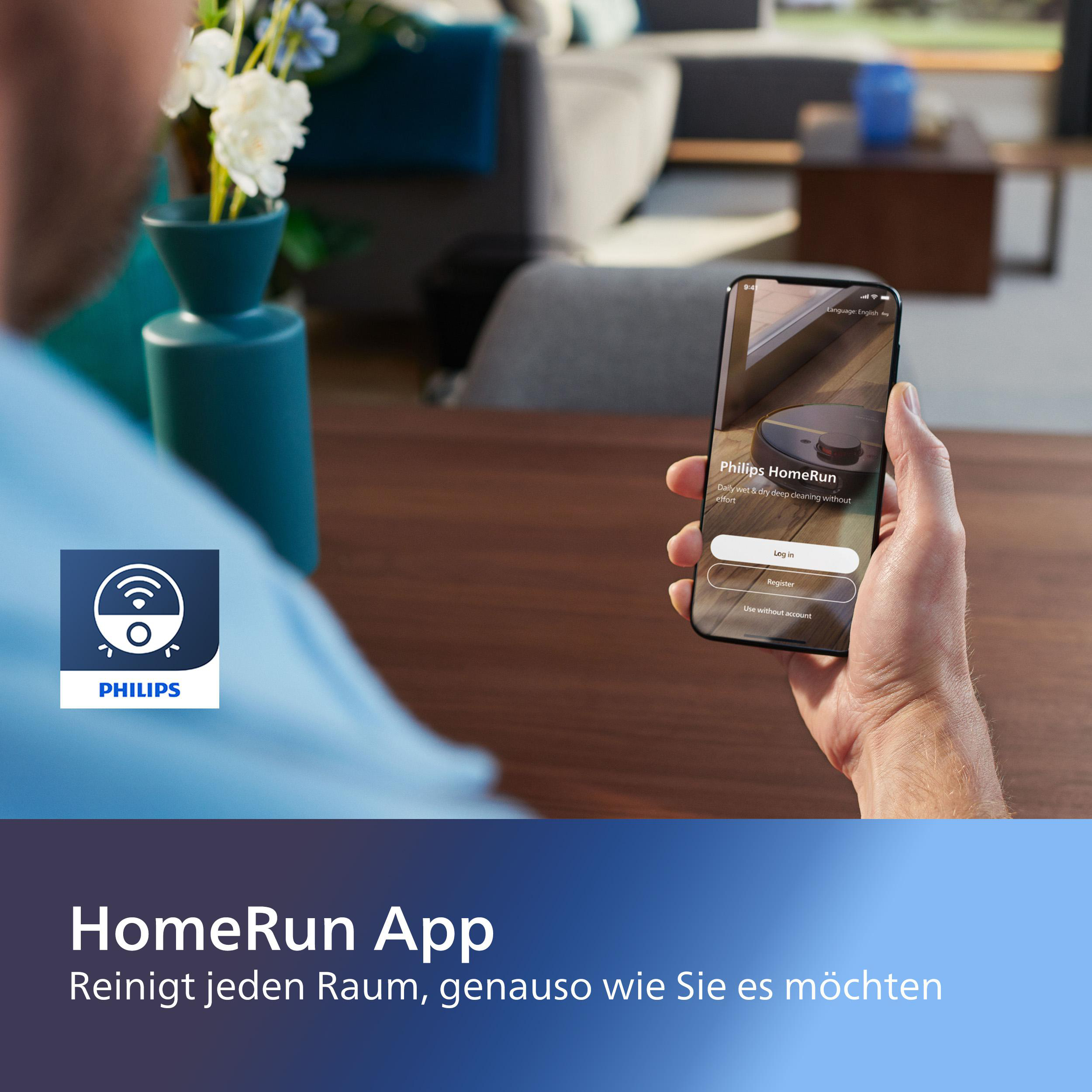 Person hält Telefon mit Philips HomeRun App-Oberfläche. Blumen und ein Logo sind zu sehen.